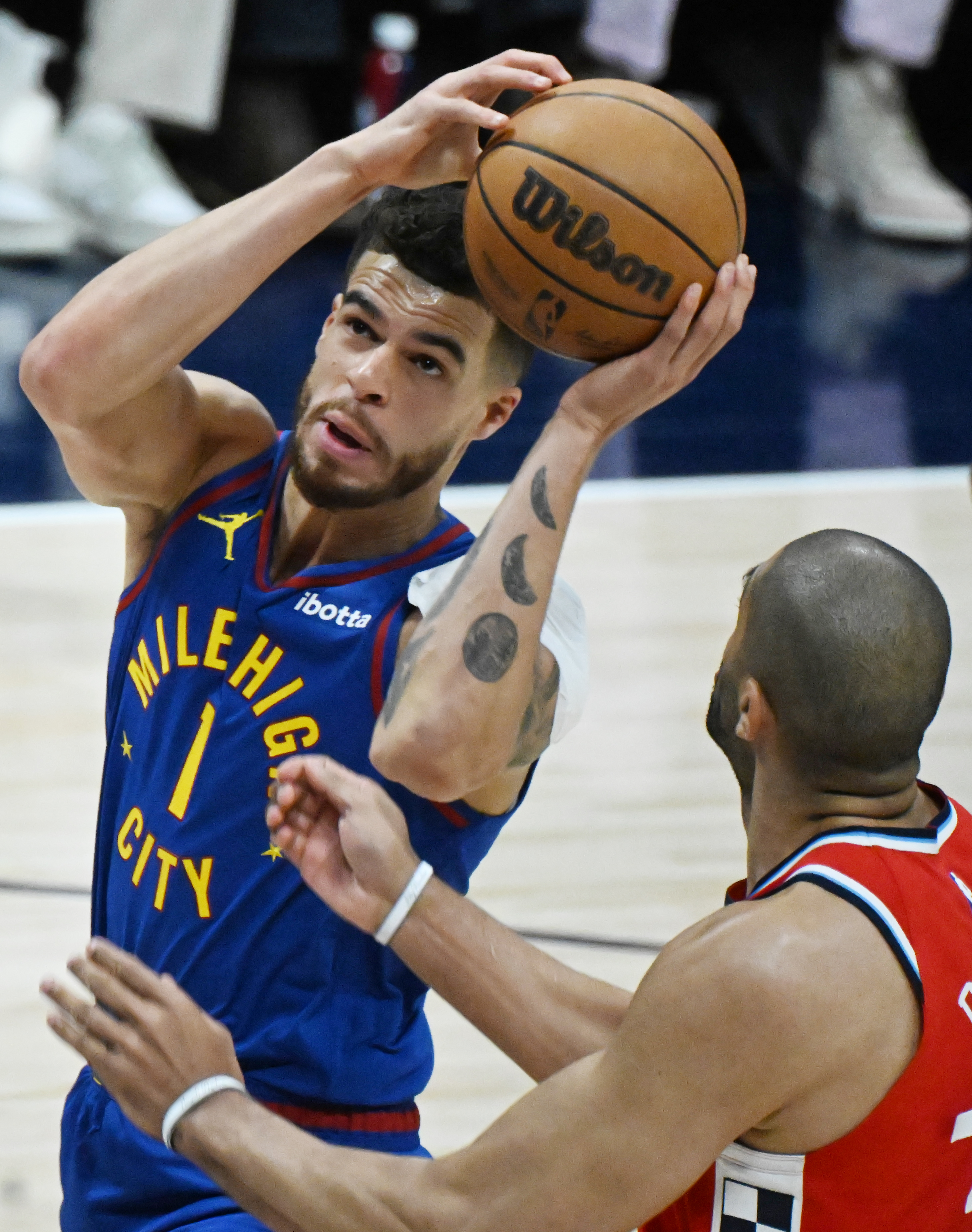 Denver Nuggets forward Michael Porter Jr. (1) goes up for a basket over LA Clippers forward Nicolas Batum (33) during the first quarter of game 7 against the Clippers in the first round of the Western Conference Championship on Saturday, May 3, 2025 at Ball Arena. (Jerilee Bennett,The Gazette)