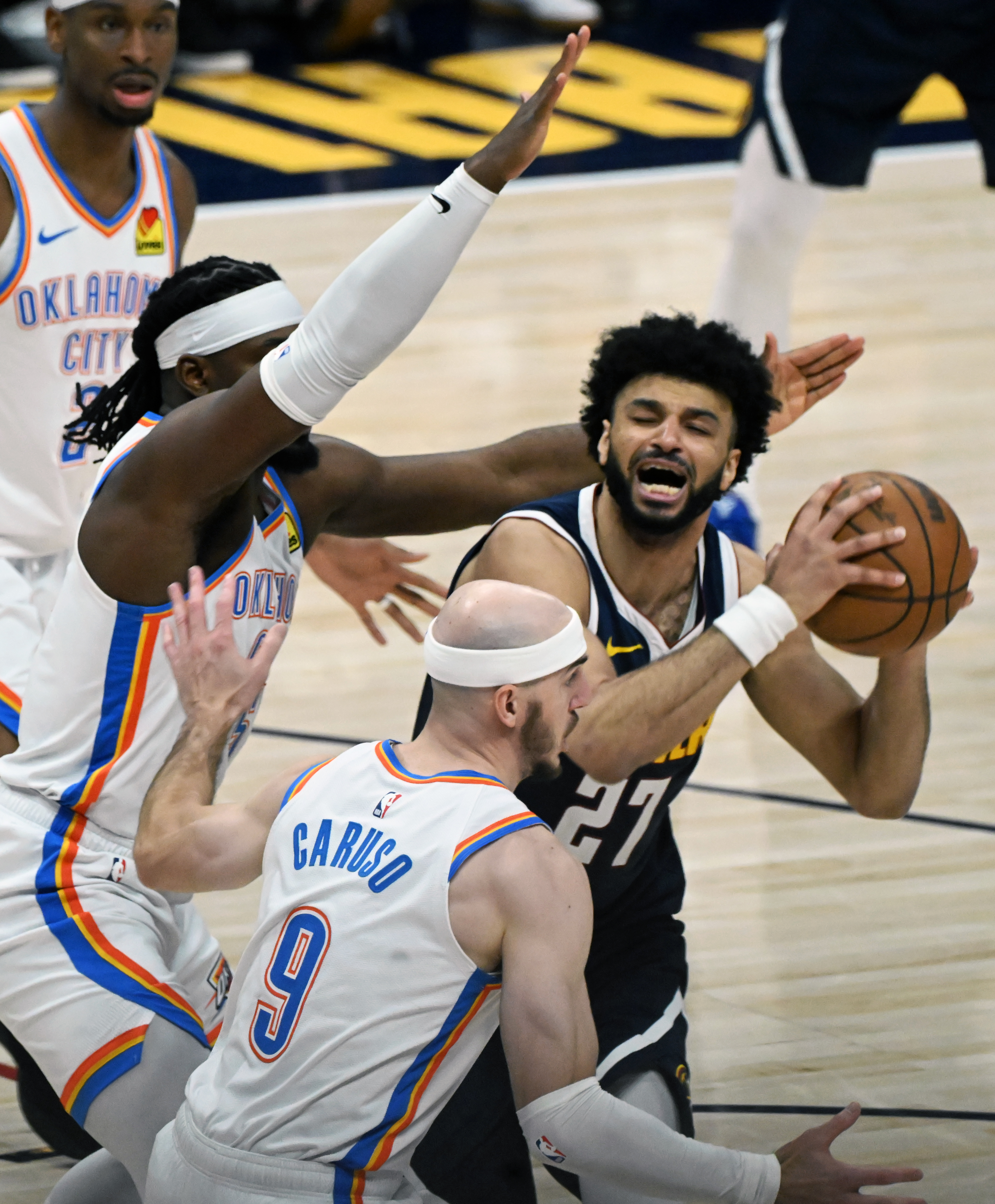 Denver Nuggets guard Jamal Murray (27) is defended by Oklahoma City Thunder guard Luguentz Dort (5) an during the 2nd quarter of game 4 of the second round of the Western Conference Championship at Ball Arena on Sunday, May 11, 2025. (Jerilee Bennett,The Gazette)