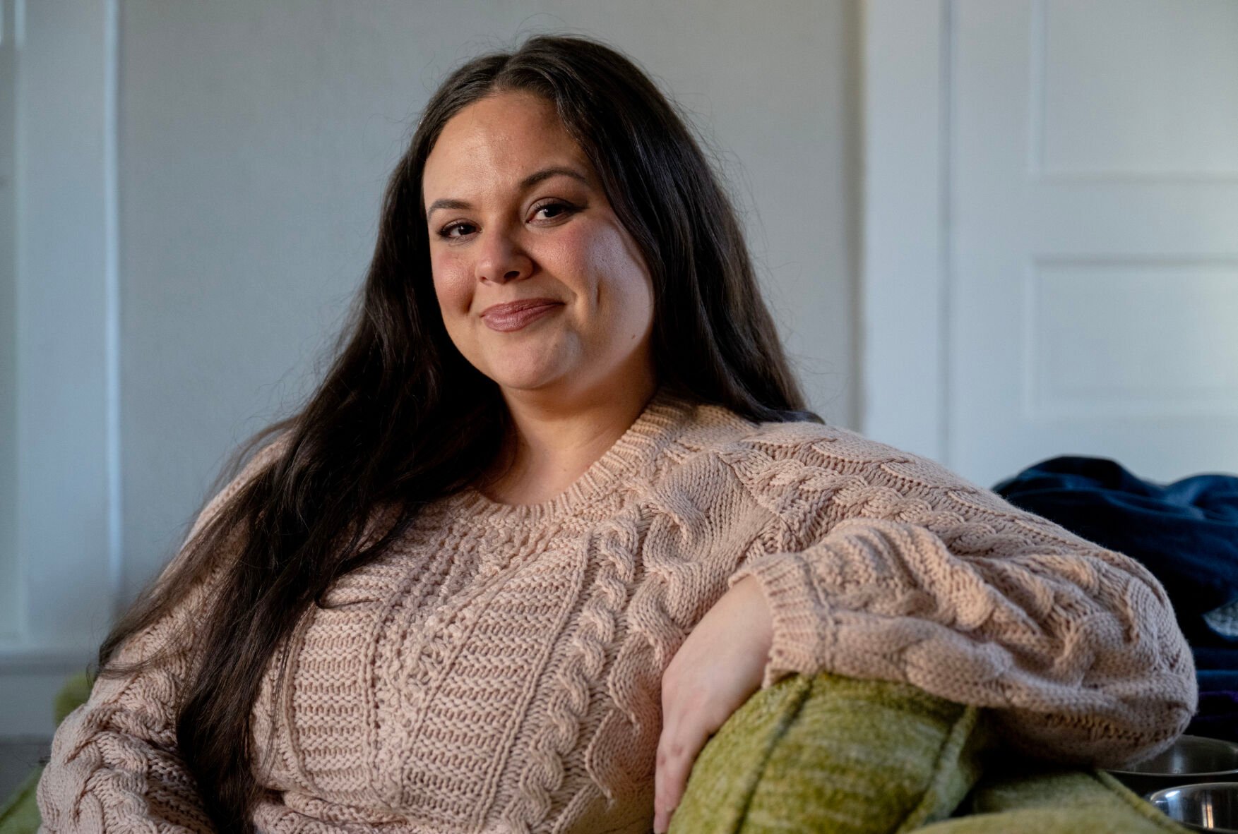 Katie Liberatore, founder of the local initiative A Mom’s Guide to Survive, poses for a portrait in her home this month in Colorado Springs. (Parker Seibold, the gazette)