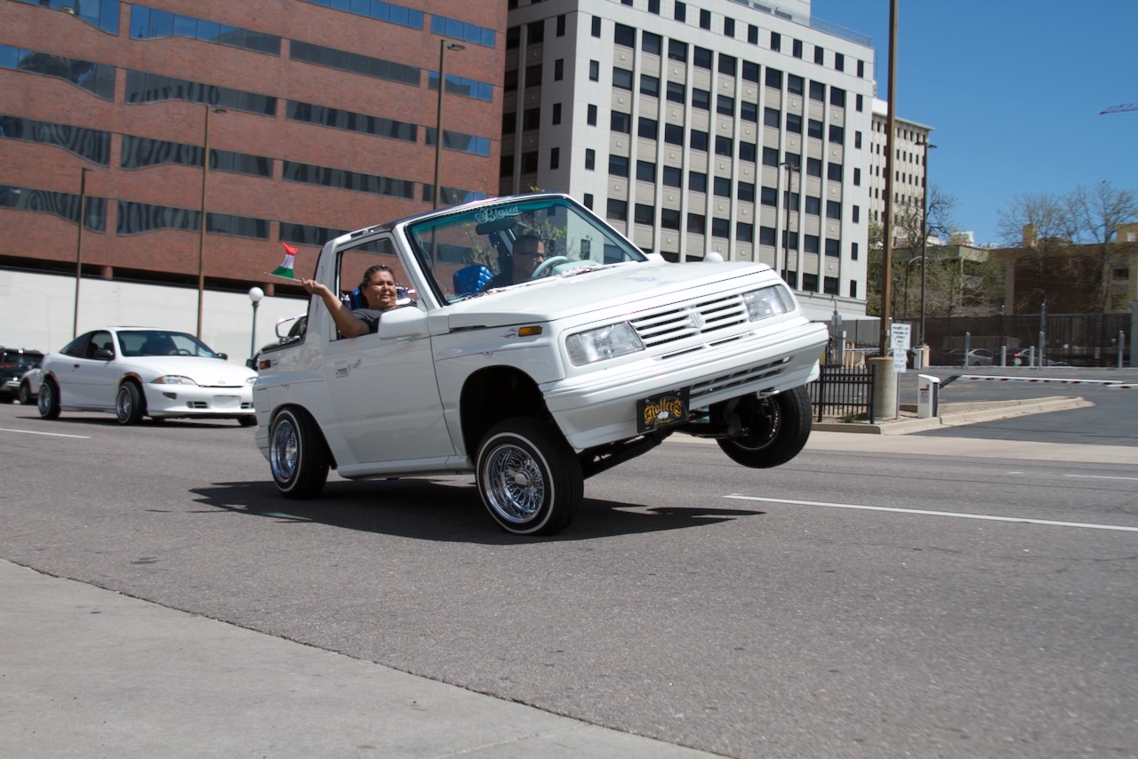 FILE PHOTO: A car with lifts one wheel on Broadway during Denver's annual Cinco de Mayo Parade on May 6, 2023. Streets around Civic Center Park downtown will be closed from 6 p.m. Friday, to 6 a.m. Monday. Federal Boulevard will be limited to one lane in each direction from Evans to 6th Avenues Friday through Sunday for 2025's celebration. (AlexanderEdwardsBusiness Reporteralex.edwards@gazette.comhttps://secure.gravatar.com/avatar/dbaa50cc8a9183e280c297e3afa72ace?d=mm&r=g)