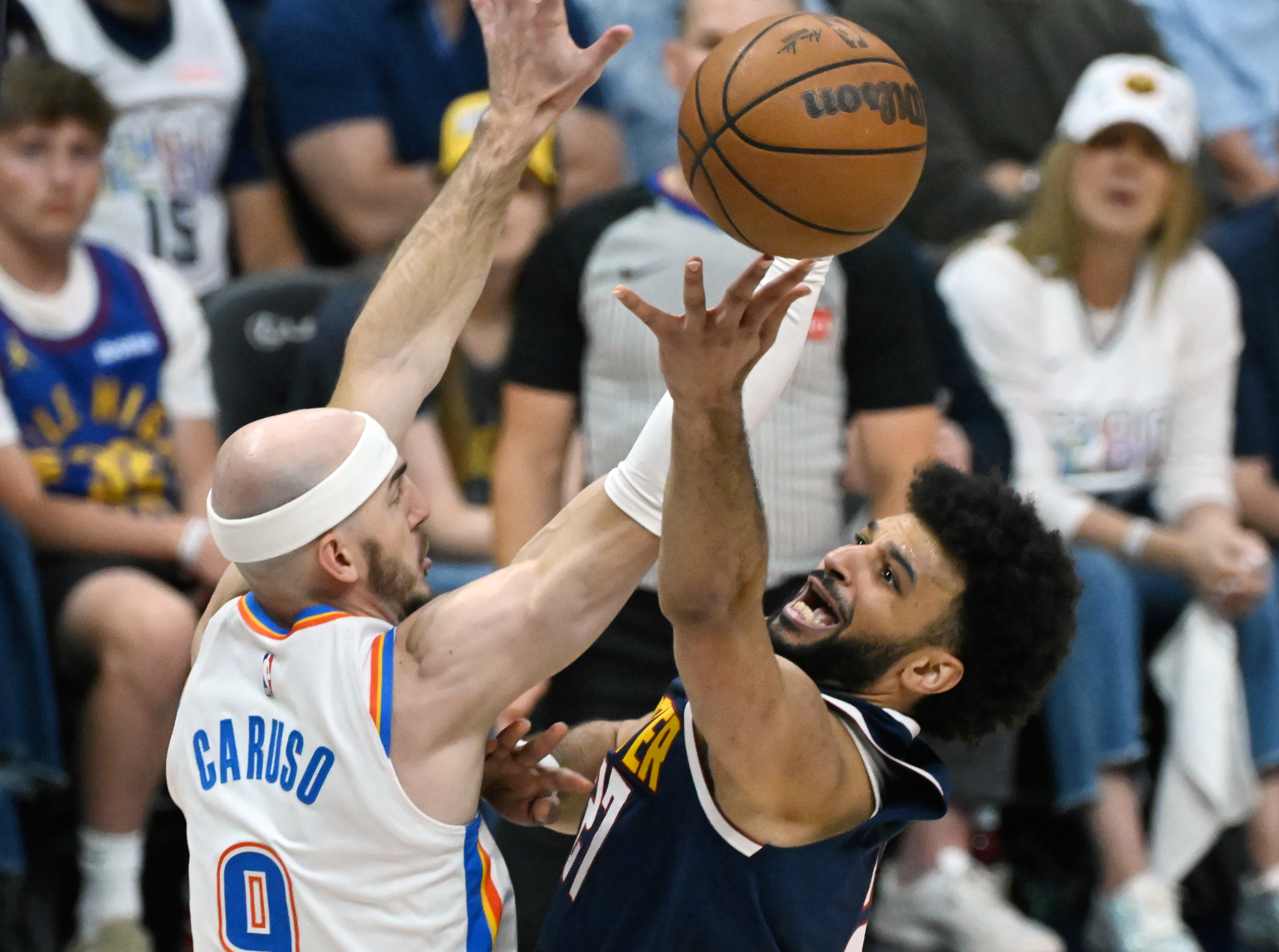 Denver Nuggets guard Jamal Murray (27) shoots the ball past Oklahoma City Thunder guard Alex Caruso (9) for a basket during the 1st quarter of game 4 of the second round of the Western Conference Championship at Ball Arena on Sunday, May 11, 2025. (Jerilee Bennett,The Gazette)