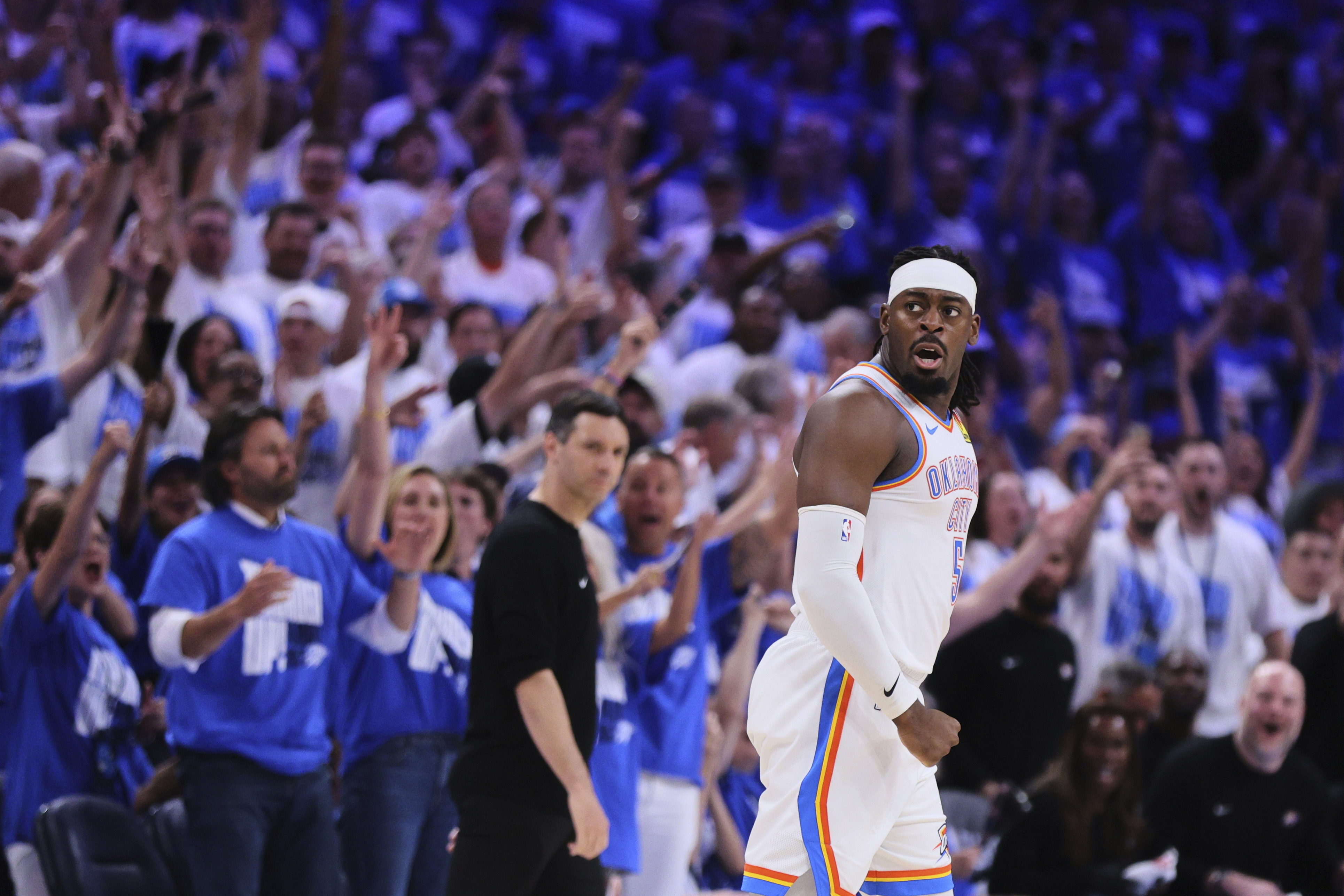 Fans cheer as Oklahoma City Thunder's Luguentz Dort celebrates sinking a three-pointer in the second half of Game 5 of an NBA basketball second-round playoff series against the Denver Nuggets Tuesday, May 13, 2025, in Oklahoma City. (AP Photo/Nate Billings) (Nate Billings)