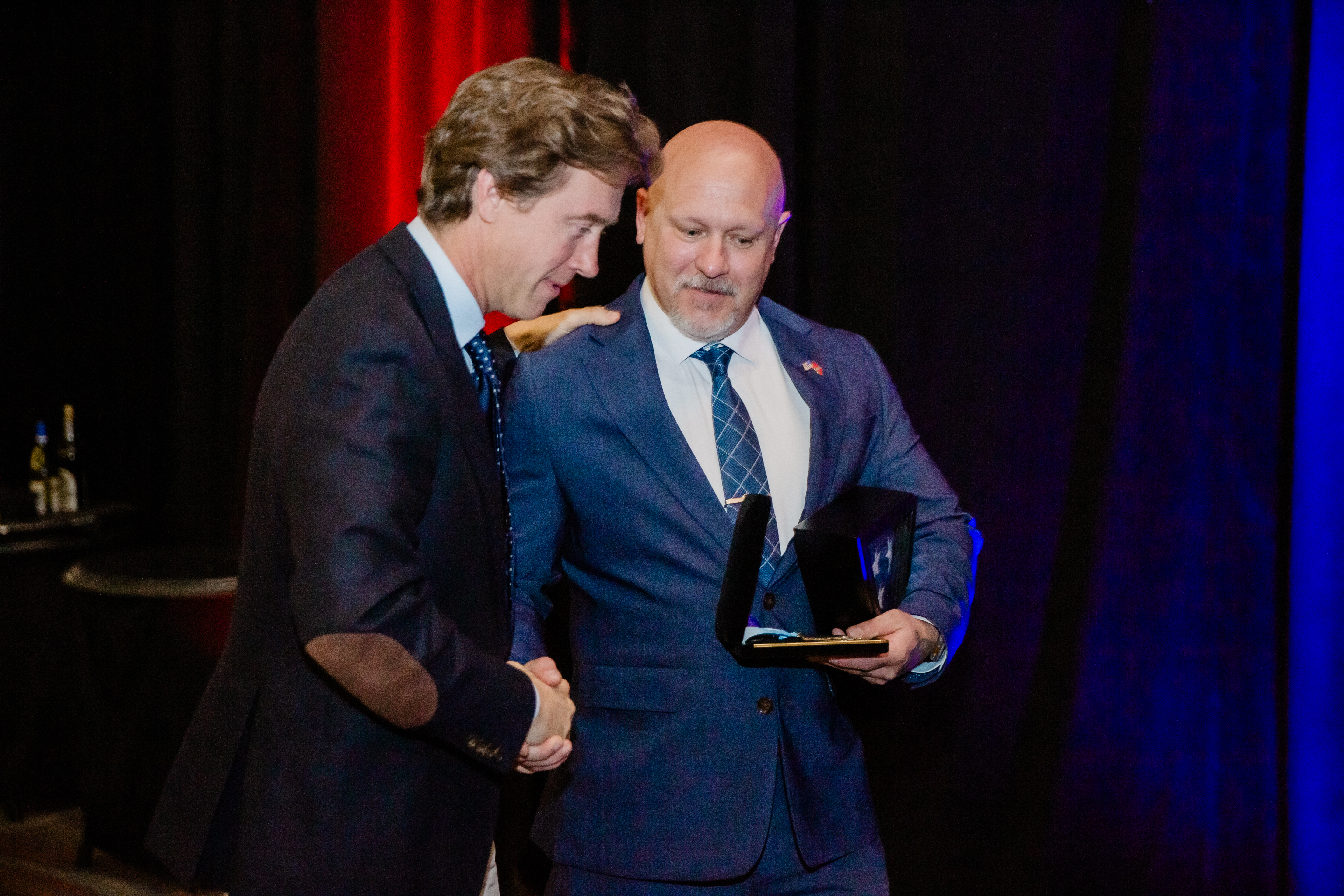Denver Mayor Mike Johnston congratulates and thanks Det. Jay Lopez who received the Medal of Honor and a Purple Heart at the Denver Police Foundation Honoring our Heroes gala Thursday at the Hyatt Regency Convention Center in Denver. (Courtesy photo, Jen Creed/Denver Police Foundation) (Courtesy photo, Jen Creed/Denver Police Foundation)
