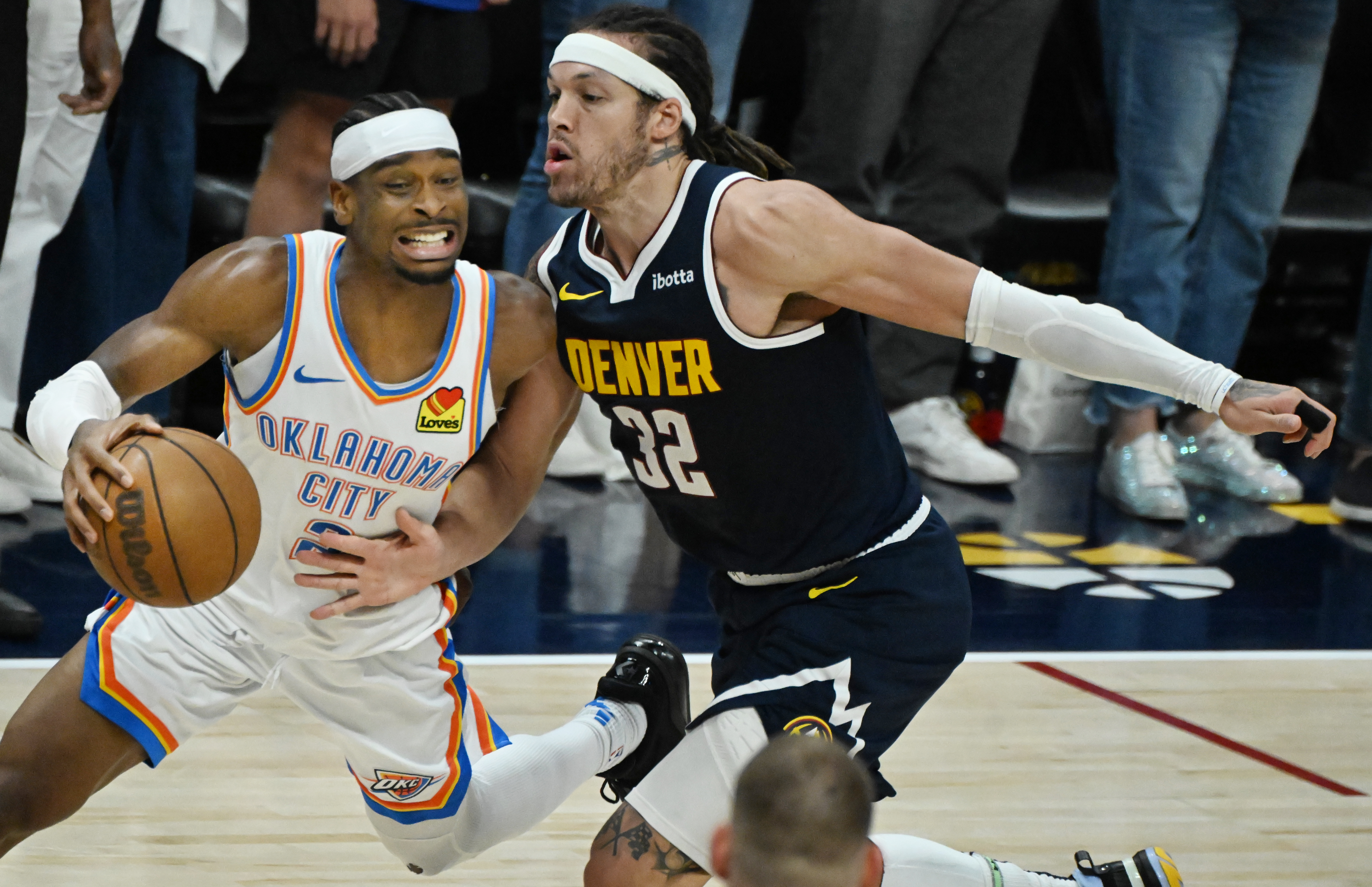 Denver Nuggets forward Aaron Gordon (32) pressures Oklahoma City Thunder guard Shai Gilgeous-Alexander (2) during the 4th quarter of game 4 of the second round of the Western Conference Championship at Ball Arena on Sunday, May 11, 2025. (Jerilee Bennett,The Gazette)