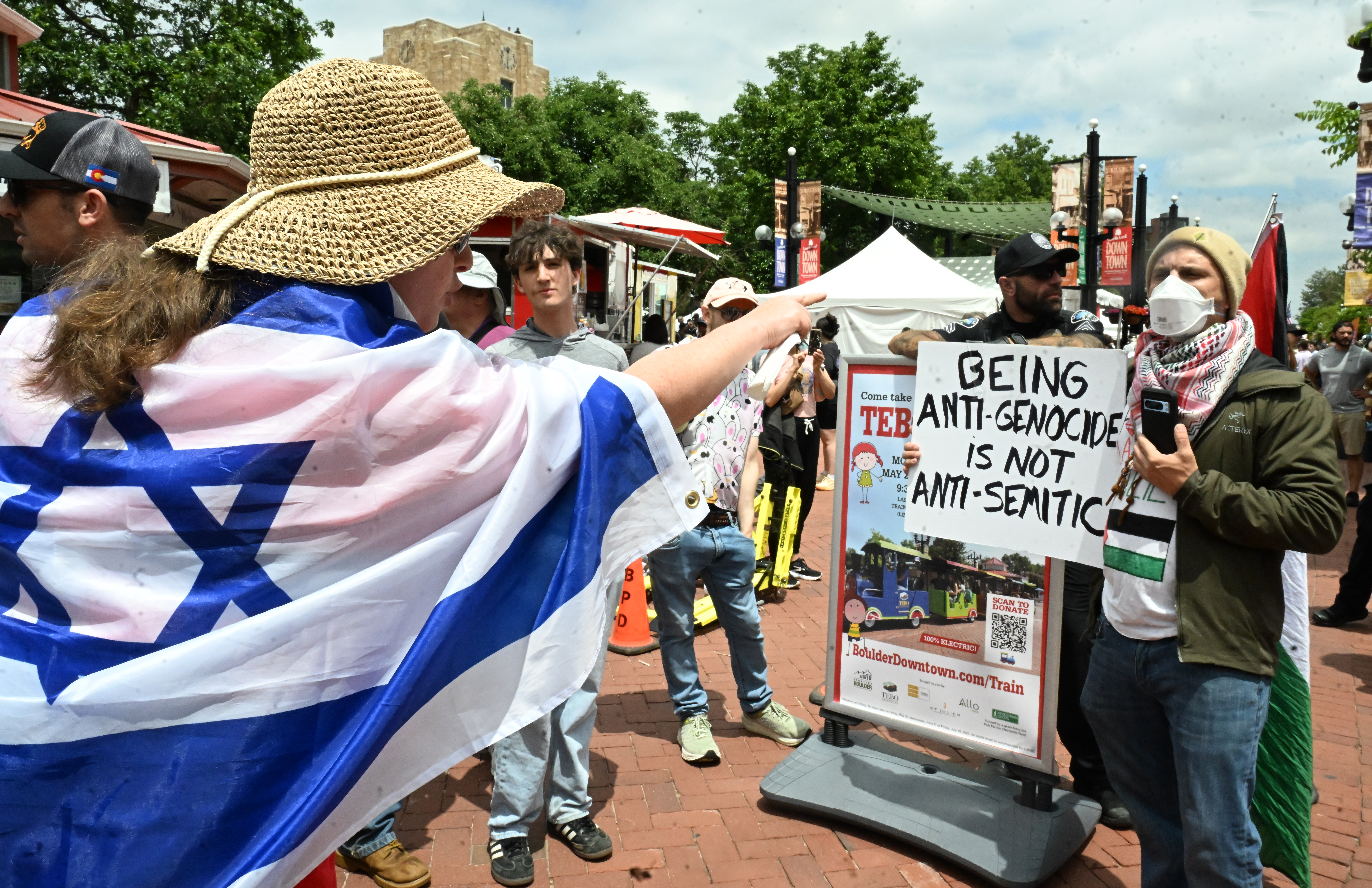 A peaceful counterprotester, who said he was Jewish, gets into an argument with a participant for the Run For Their Lives walk on the Pearl Street Mall. They walked in the same location as last week along the Pearl Street Mall on Sunday, June 8, 2025. Last weeks walk ended with a man using makeshift molotov cocktails to set the peaceful protesters on fire. The walk has been held every week in cities around the country to make sure that the hostages in Gaza, that were taken on Oct. 7, 2023, are not forgotten.