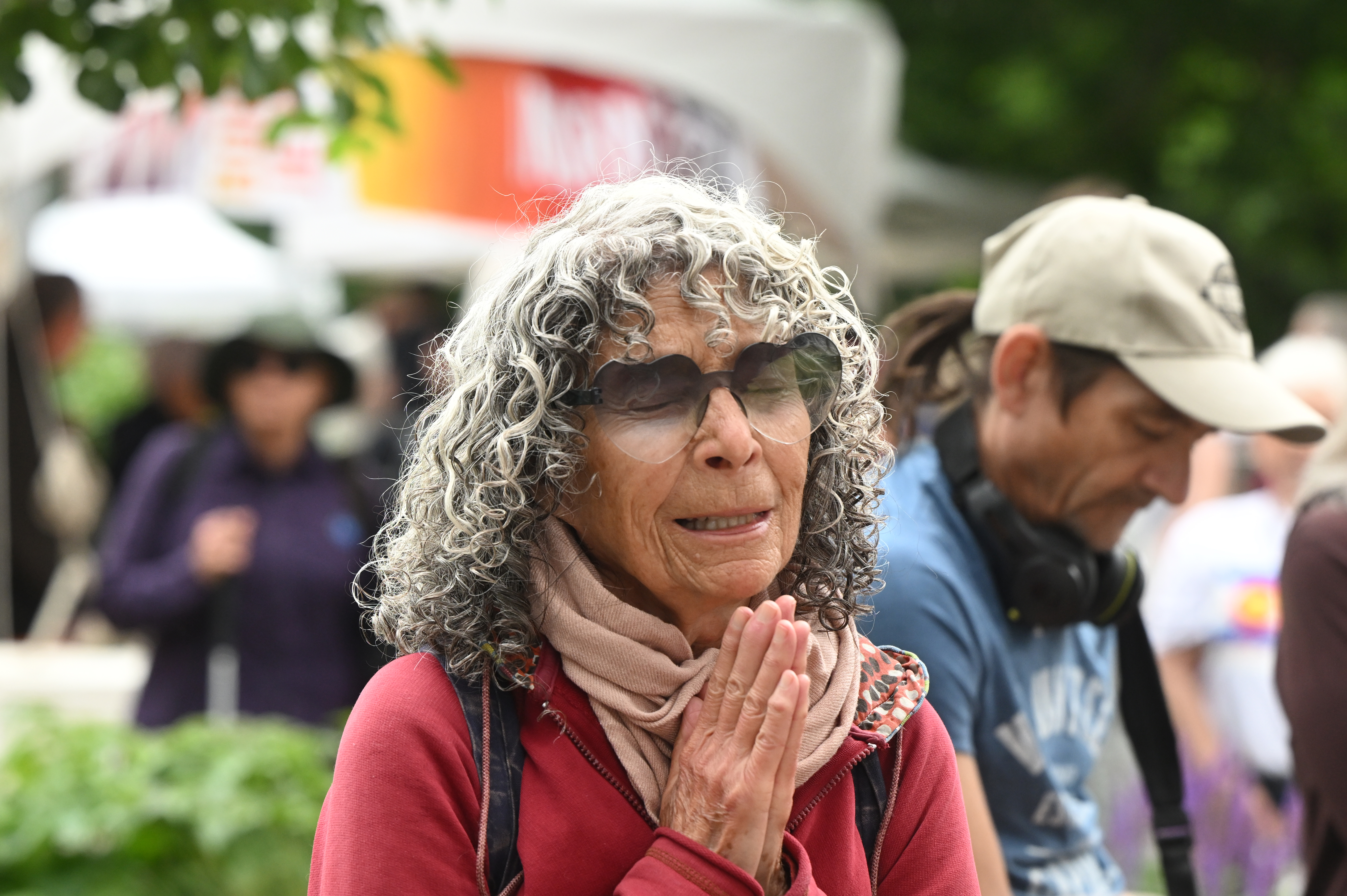 Kriya Goodman says a prayer after participating in the Run For Their Lives walk . They walked in the same location as last week along the Pearl Street Mall on Sunday, June 8, 2025. Last weeks walk ended with a man using makeshift molotov cocktails to set the peaceful protesters on fire. The walk has been held every week in cities around the country to make sure that the hostages in Gaza, that were taken on Oct. 7, 2023, are not forgotten.
