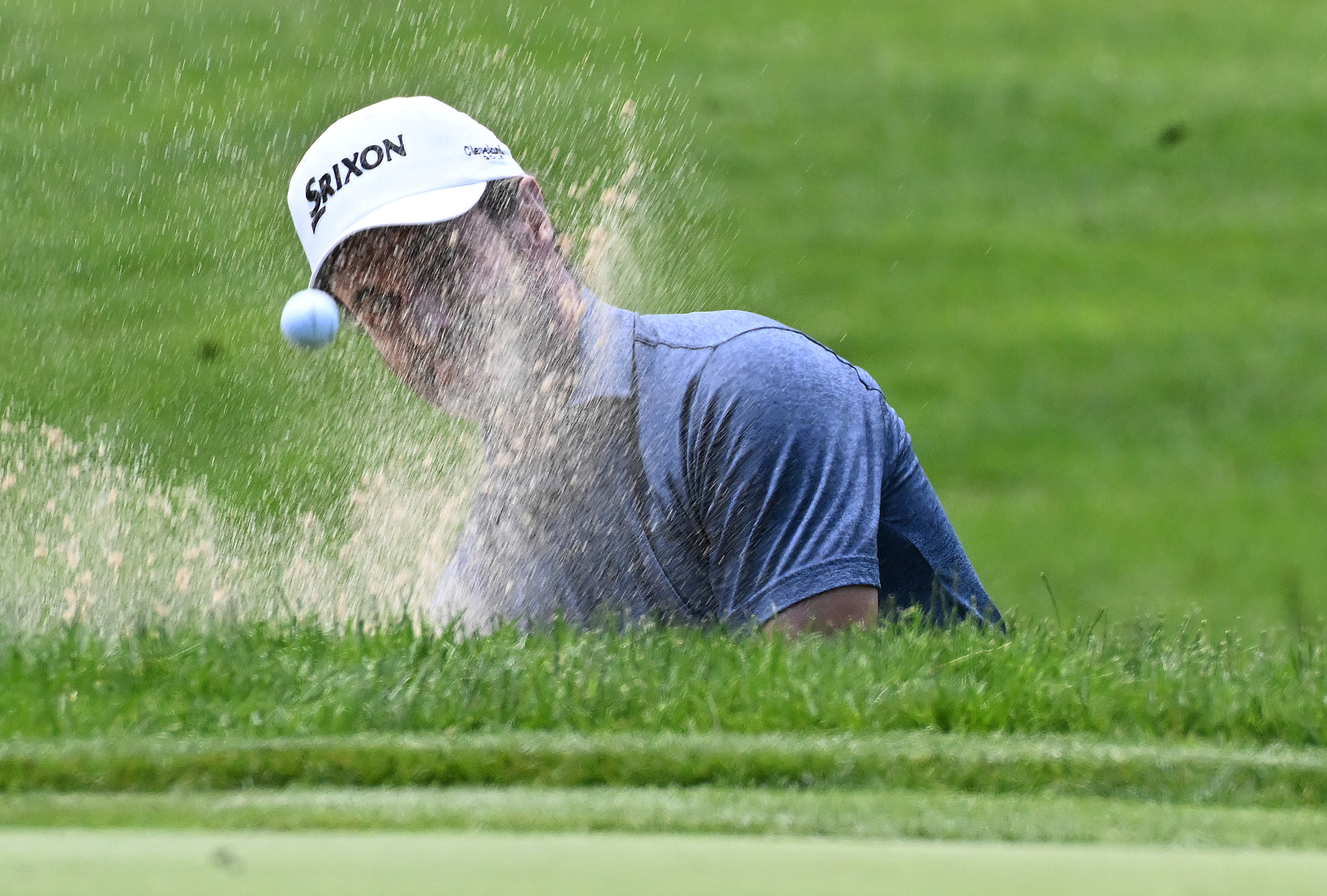 Mark Hensby hits out of the sandtrap on the 17th hole during the first session of the first day of play at the U.S. Senior Open Championship at the Broadmoor Golf Club on Thursday, June 26, 2025. Hensby ended up in first place of the golfers who teed off in the morning with a score of -3.