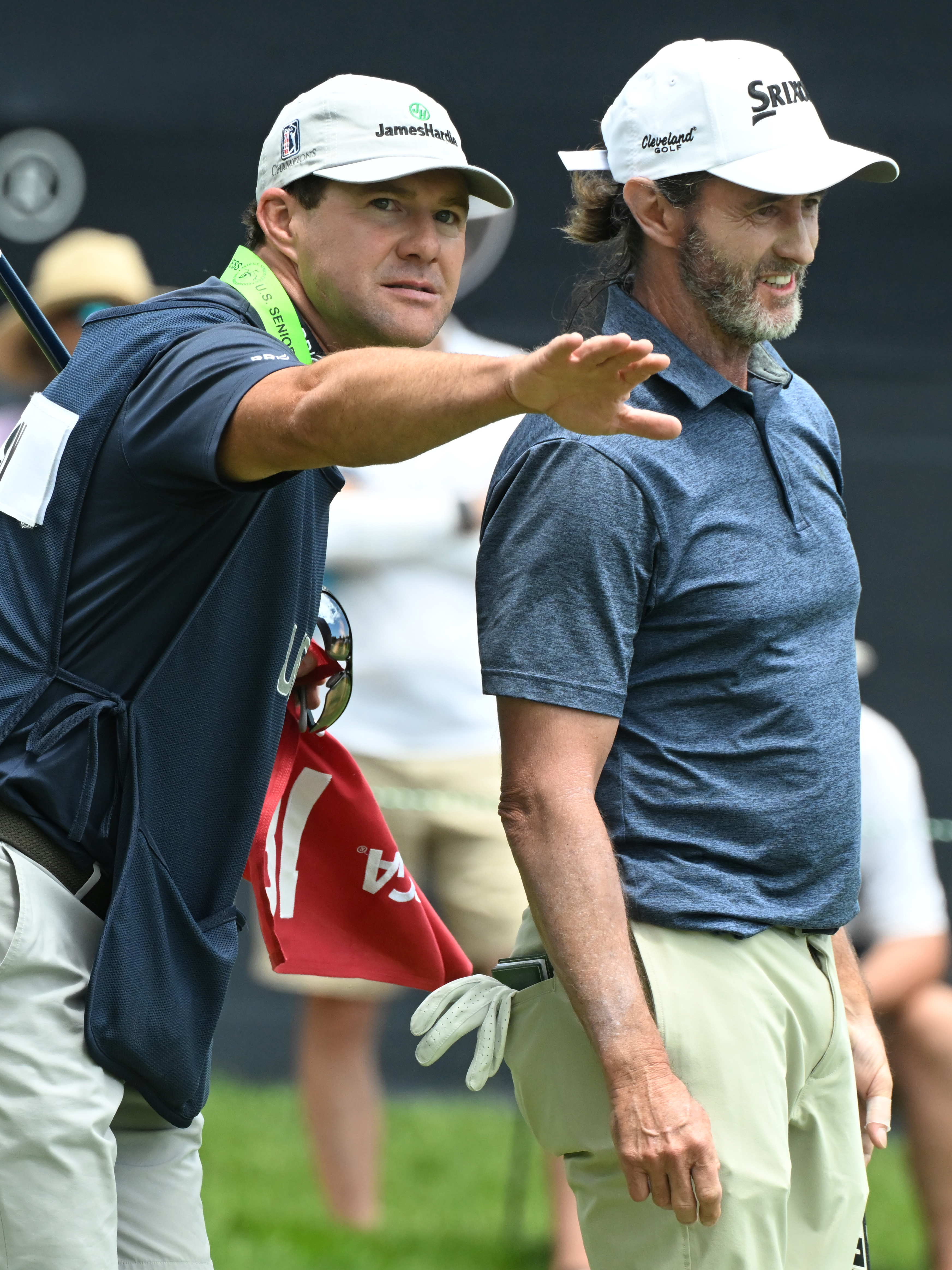 Mark Hensby gets advice from caddie Austin Watson on the 18th hole during the first session of the first day of play at the U.S. Senior Open Championship at the Broadmoor Golf Club on Thursday, June 26, 2025. Hensby ended up in first place of the golfers who teed off in the morning with a score of -3.