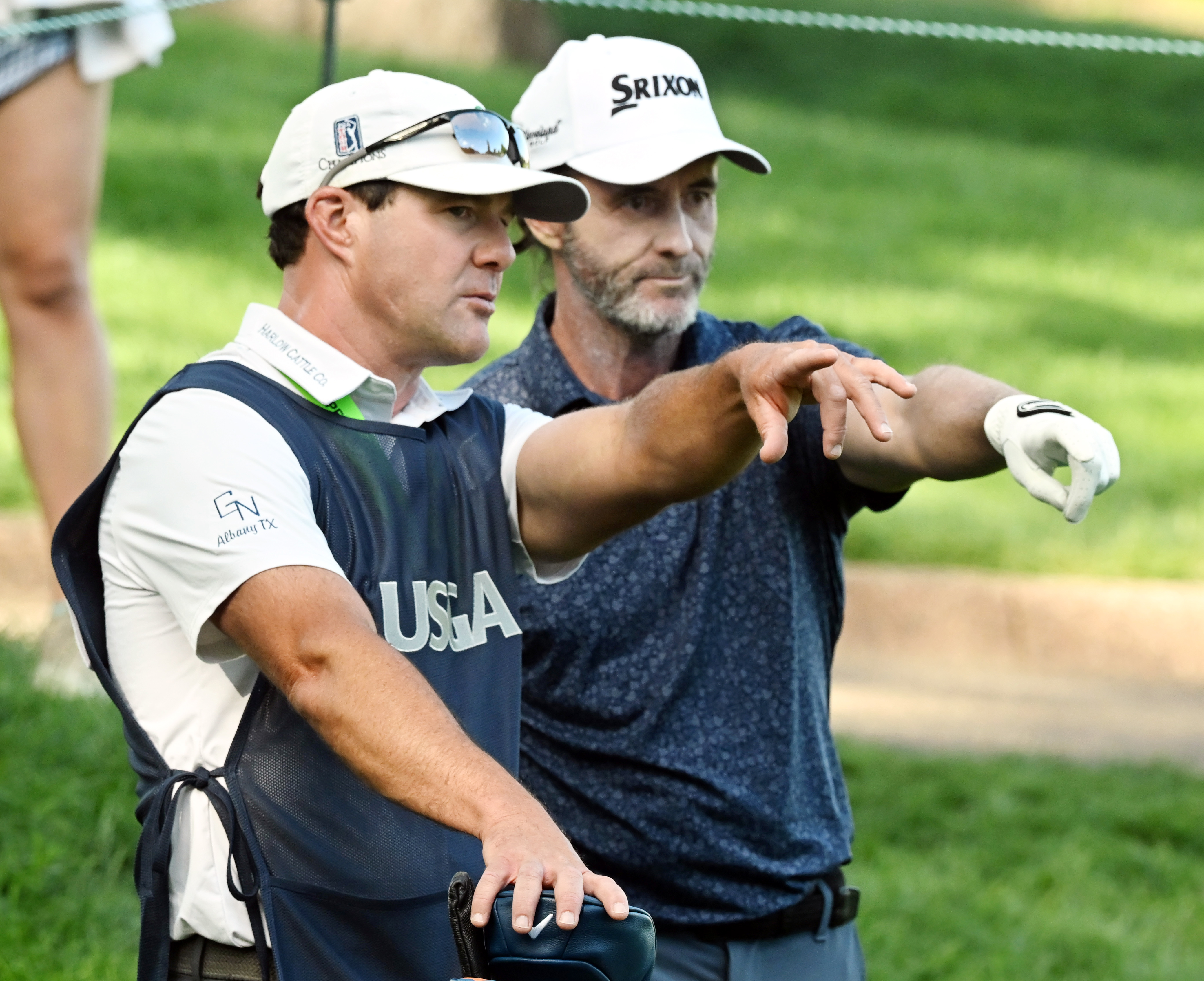 Mark Hensby confers with his caddie Austin Watson on hole 3 on day 2 of the U.S. Senior Open Championship at the Broadmoor Golf Club in Colorado Springs, Colorado on Friday, June 27, 2025. Hensby ended up in a three-way tie with Padraig Harrington and Stewart Cink with a score of -6. (Jerilee Bennett, The Gazette)