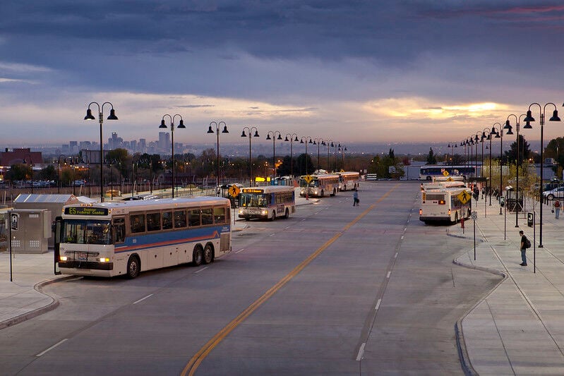 Trending video shows man hanging onto the back of RTD bus