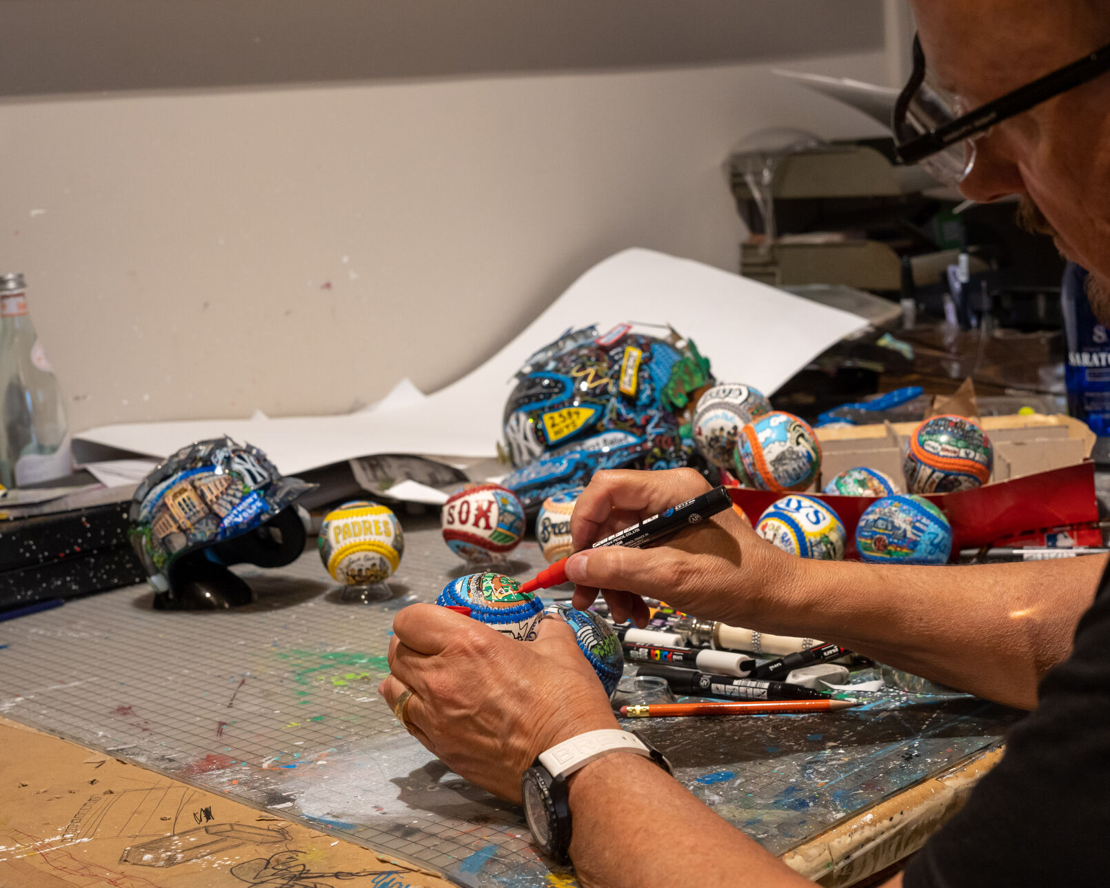 Fazzino painting baseballs-2.jpg