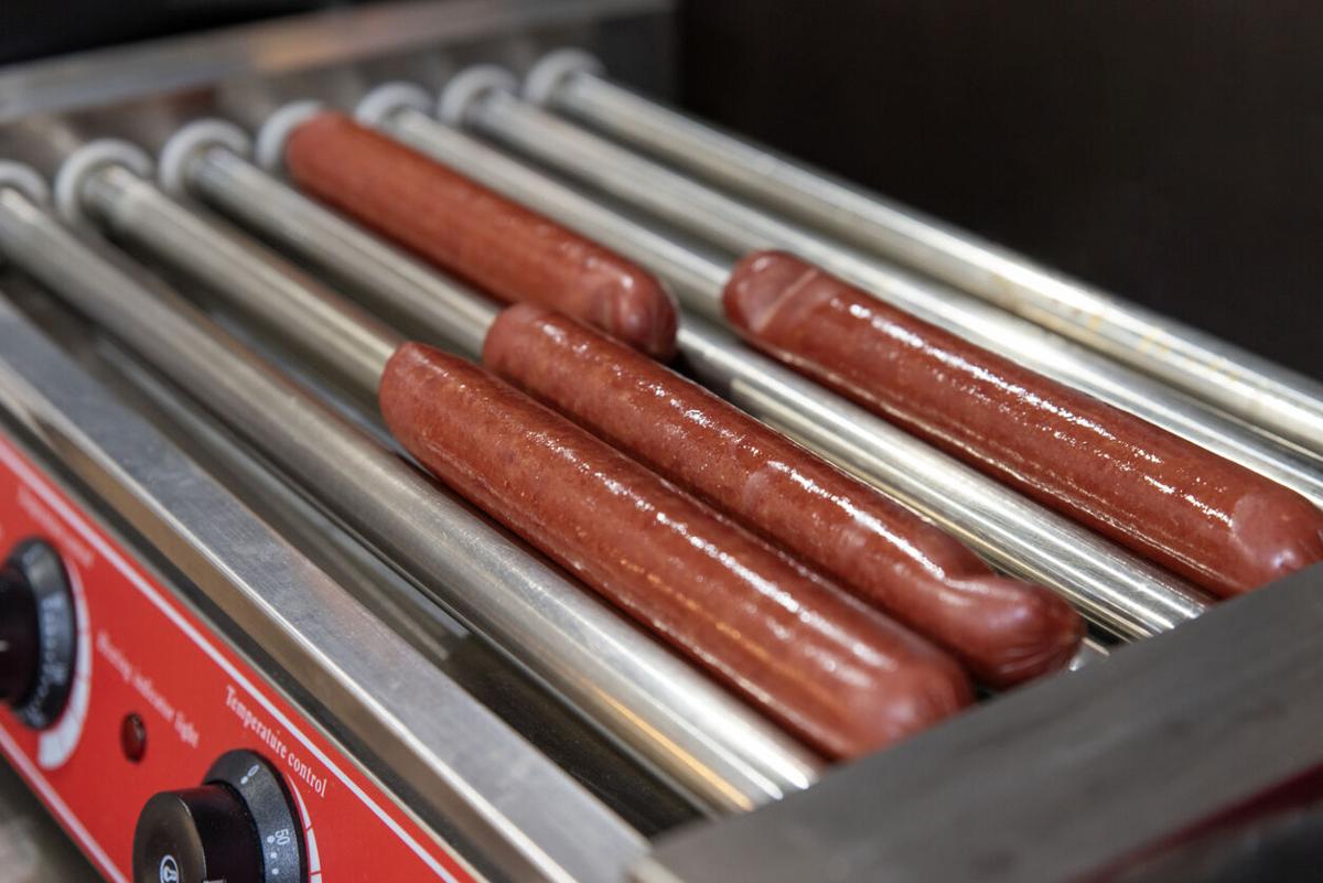 Sausages on automatic electric grill Photo Credit: sergei scherbak (iStock).