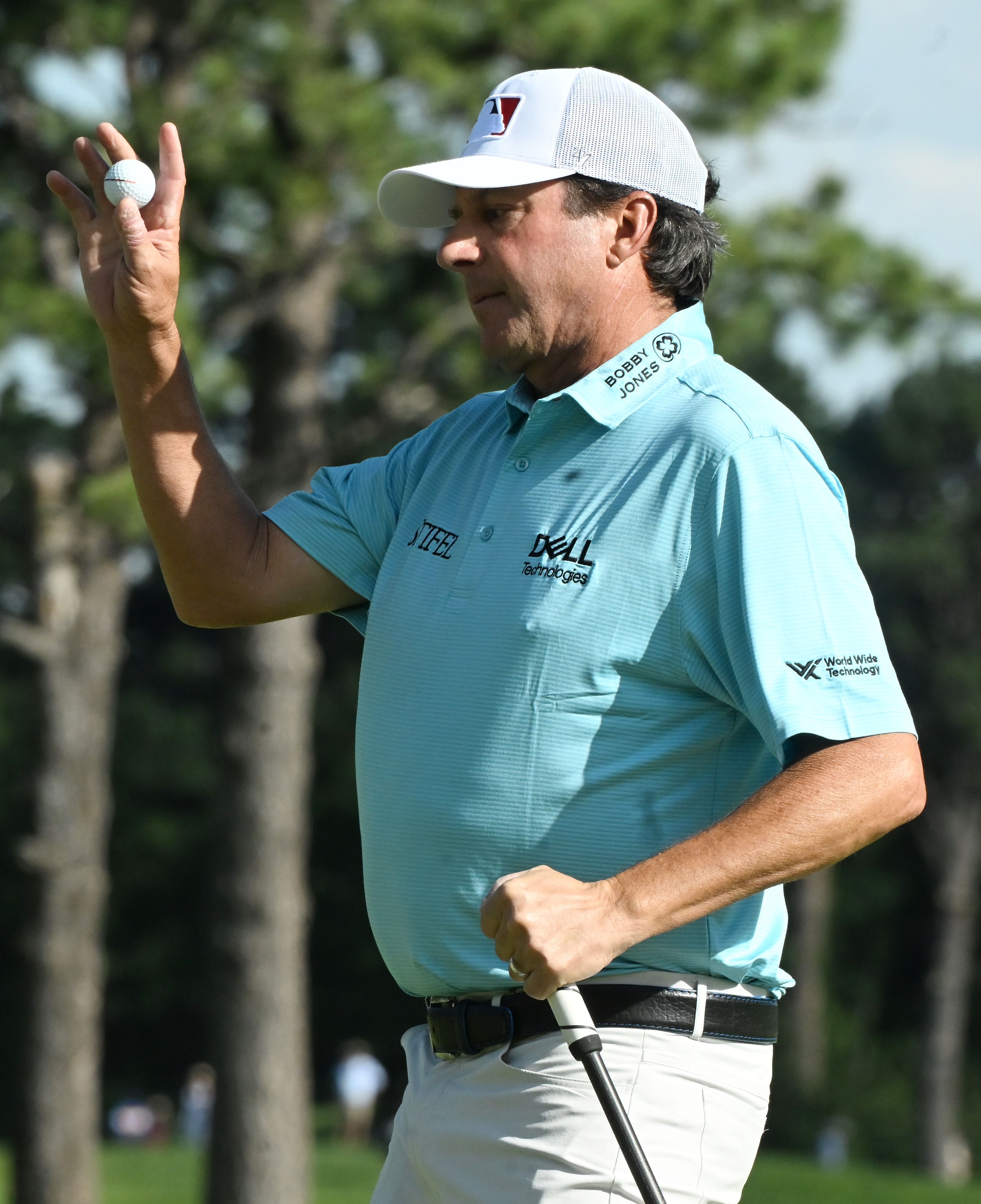 Billy Andrade holds up the ball to the applause of the crowd after hitting a birdie on the 12th hole on day 2 of the U.S. Senior Open Championship at the Broadmoor Golf Club in Colorado Springs, Colorado on Friday, June 27, 2025. (Jerilee Bennett,The Gazette)