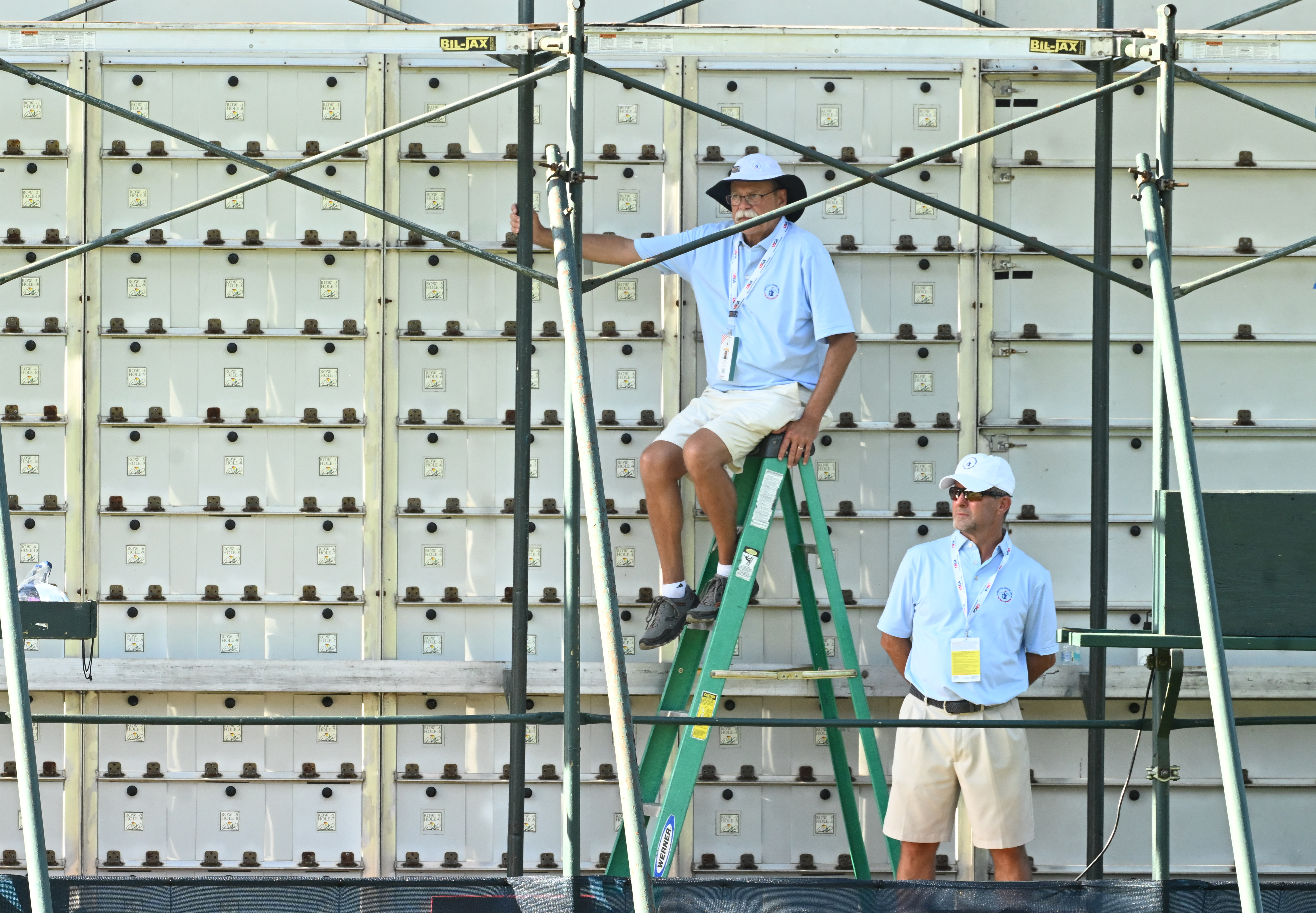 One of the jobs of a volunteers is to change the leaderboard from behind on the 18th hole. These volunteers was working on the 18th hole on day 2 of the U.S. Senior Open Championship at the Broadmoor Golf Club in Colorado Springs, Colorado on Friday, June 27, 2025. (Jerilee Bennett,The Gazette)