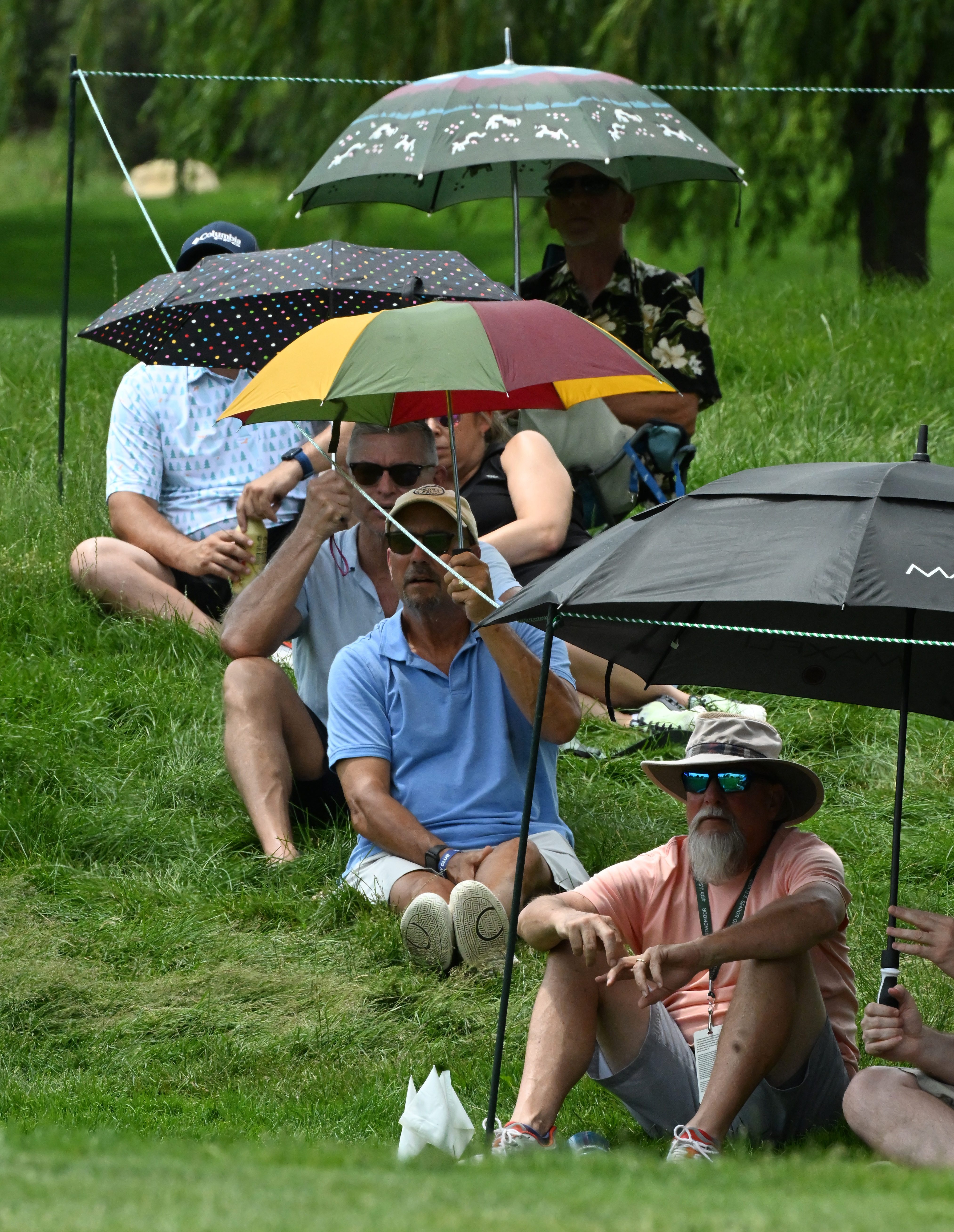 Umbrellas were just needed to keep off the sun at the U.S, Senior Open Championship on Sunday, June 29, 2025 at the Broadmoor Golf Club in Colorado Springs, Colorado. The players teed off early to avoid a forecast of afternoon thunderstorms. (Jerilee Bennett,The Gazette)