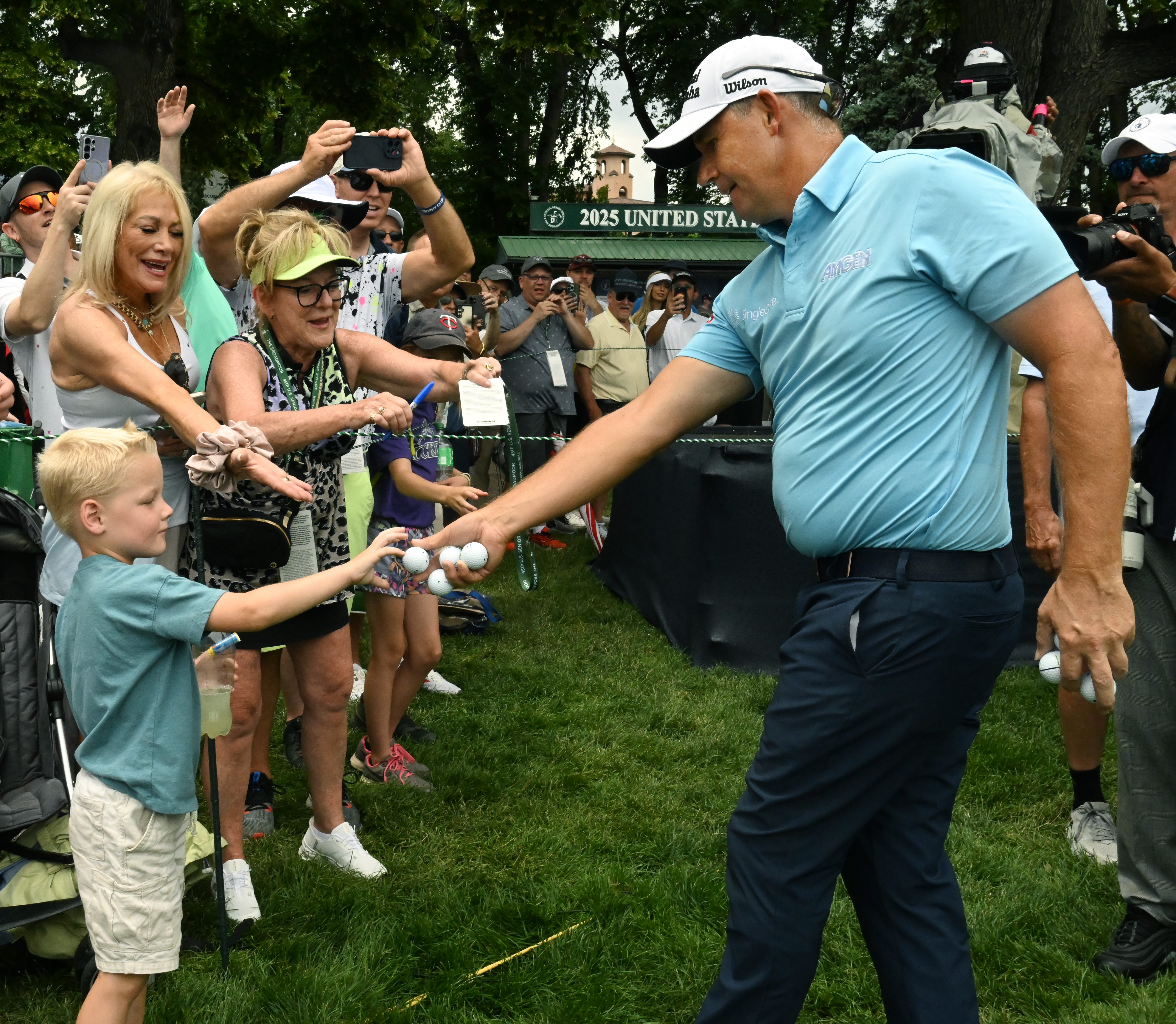 Padraig Harrington hands a ball to young Jackson Annen after winning the U.S. Senior Open Championship at the Broadmoor Golf Club in Colorado Springs, Colorado on Sunday, June 29, 2025. He finished with a score of -11. (Jerilee Bennett,The Gazette)