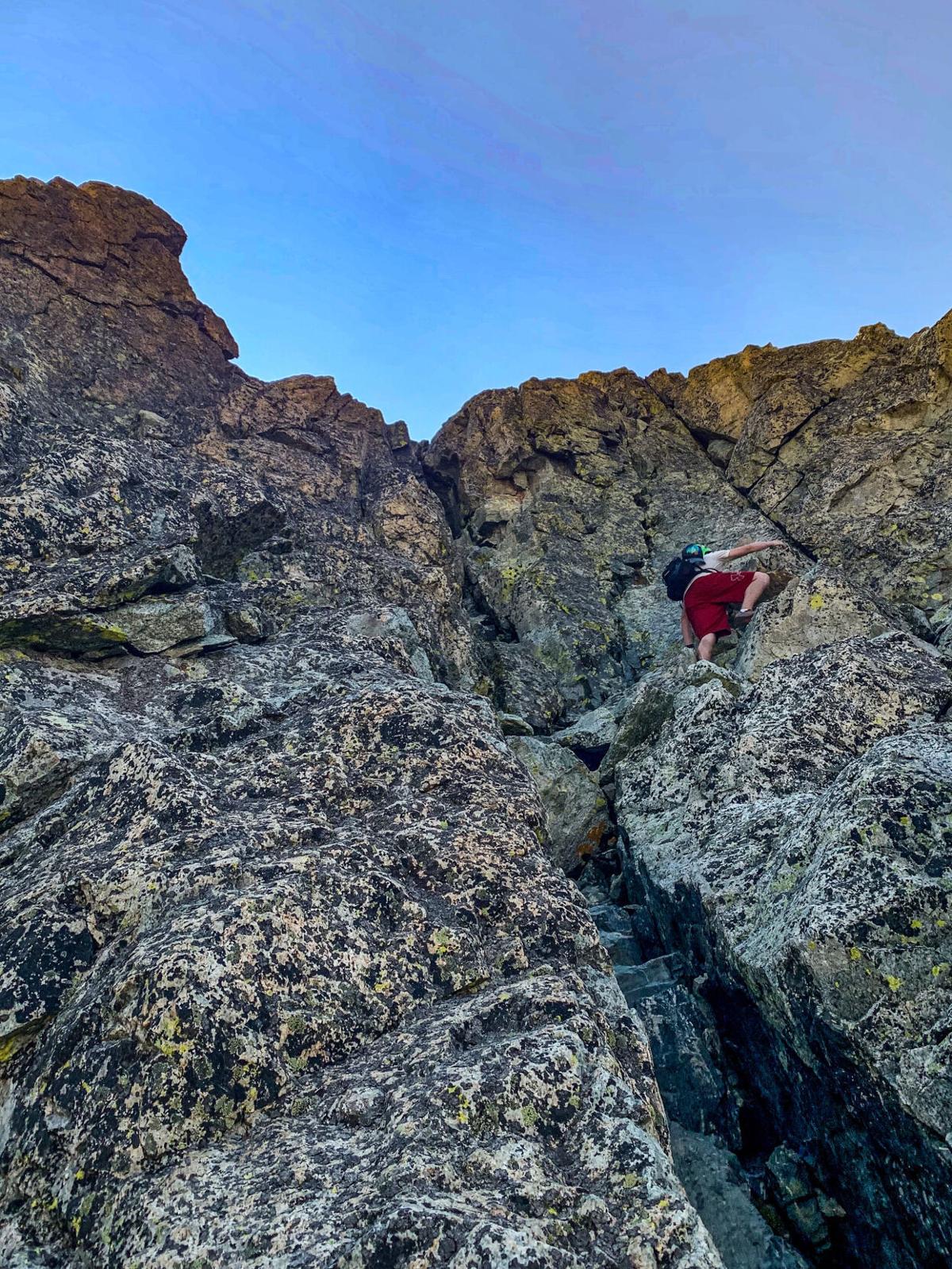 Spencer McKee on a section of Class Four climbing on Mount Lindsey. Photo Credit: Nick Kohli