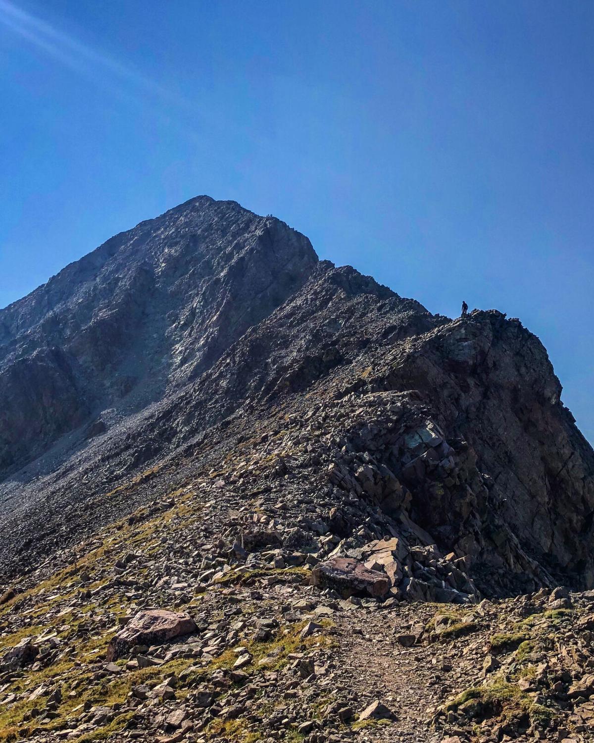 Mount Lindsey from a nearby ridge. The crux wall of the climb to the summit is the large flat wall along the ridge. Photo Credit: Spencer McKee