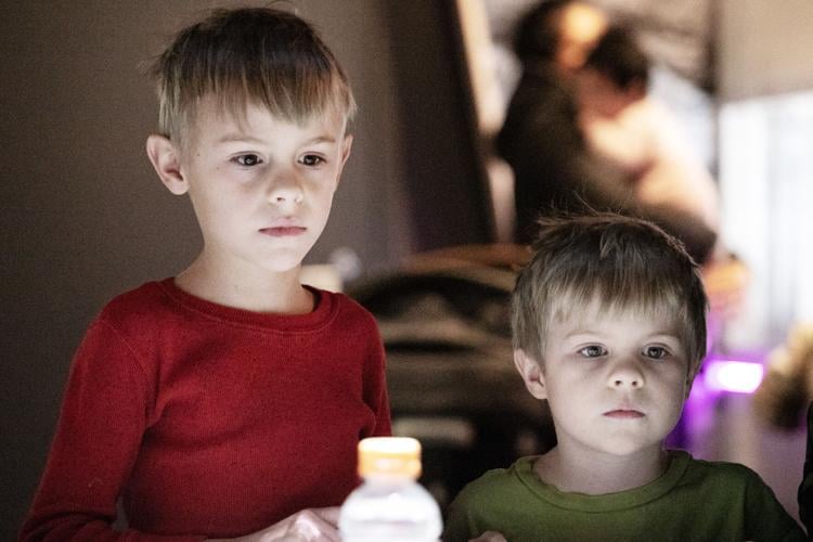 Hudson, 8, and William Graber, 6, look at an interactive map