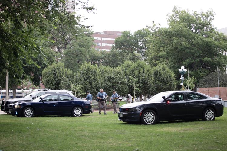 Colorado State Patrol officers arrest an individual at the Lincoln Veterans Memorial Park