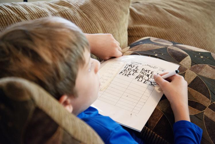 Eric Graber works on his spelling during a homeschool lesson