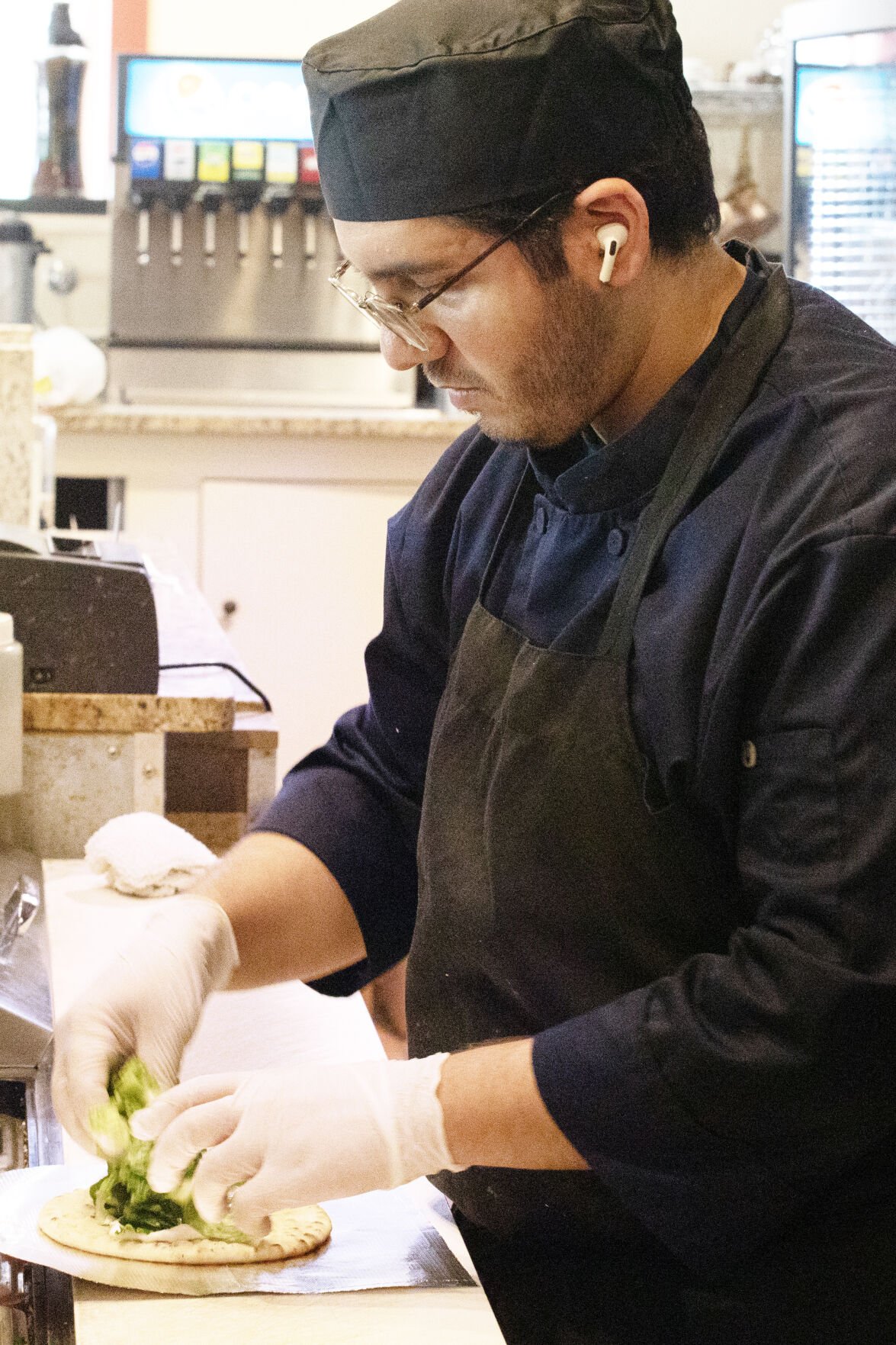 Obeid Kaifo prepares food for a customer at Shish Kabob Grill