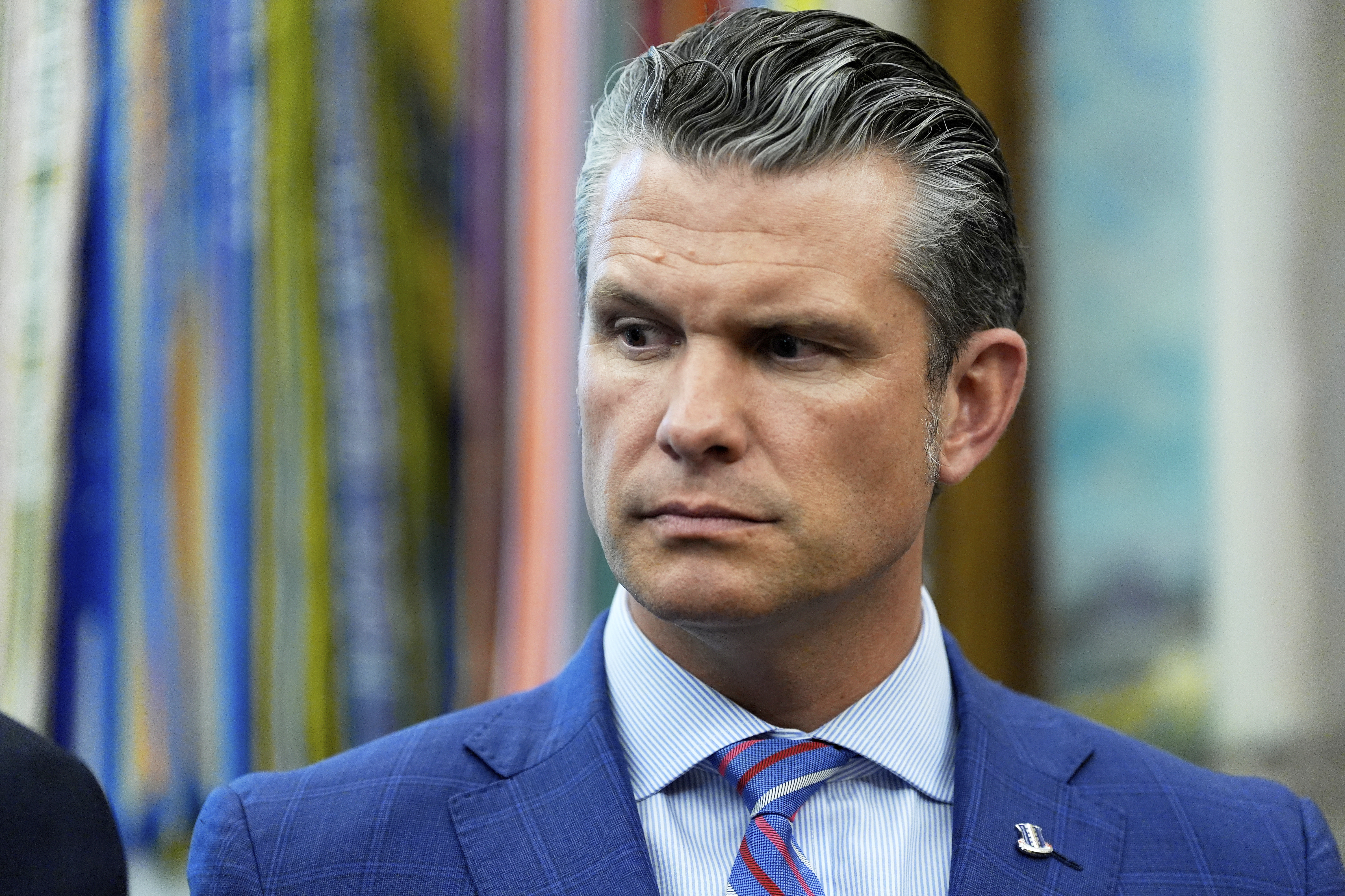 Defense Secretary Pete Hegseth listens as President Donald Trump speaks in the Oval Office of the White House, Monday, Sept. 15, 2025, in Washington. (Alex Brandon - AP)