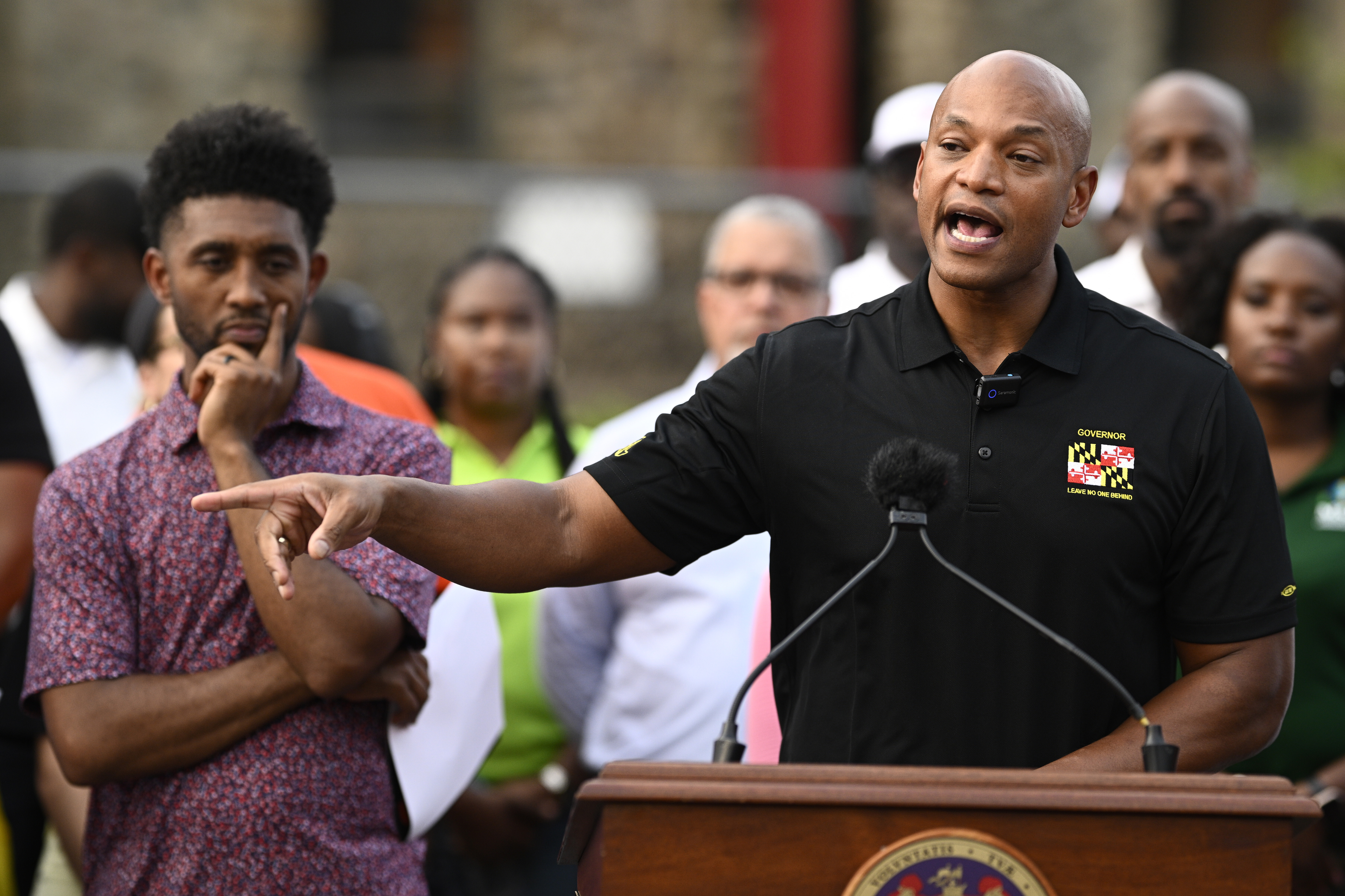 FILE - Maryland Gov. Wes Moore, right, speaks next to Baltimore mayor Brandon Scott, left, during a news conference, Sept. 5, 2025, in Baltimore. (Nick Wass - FR67404 AP)