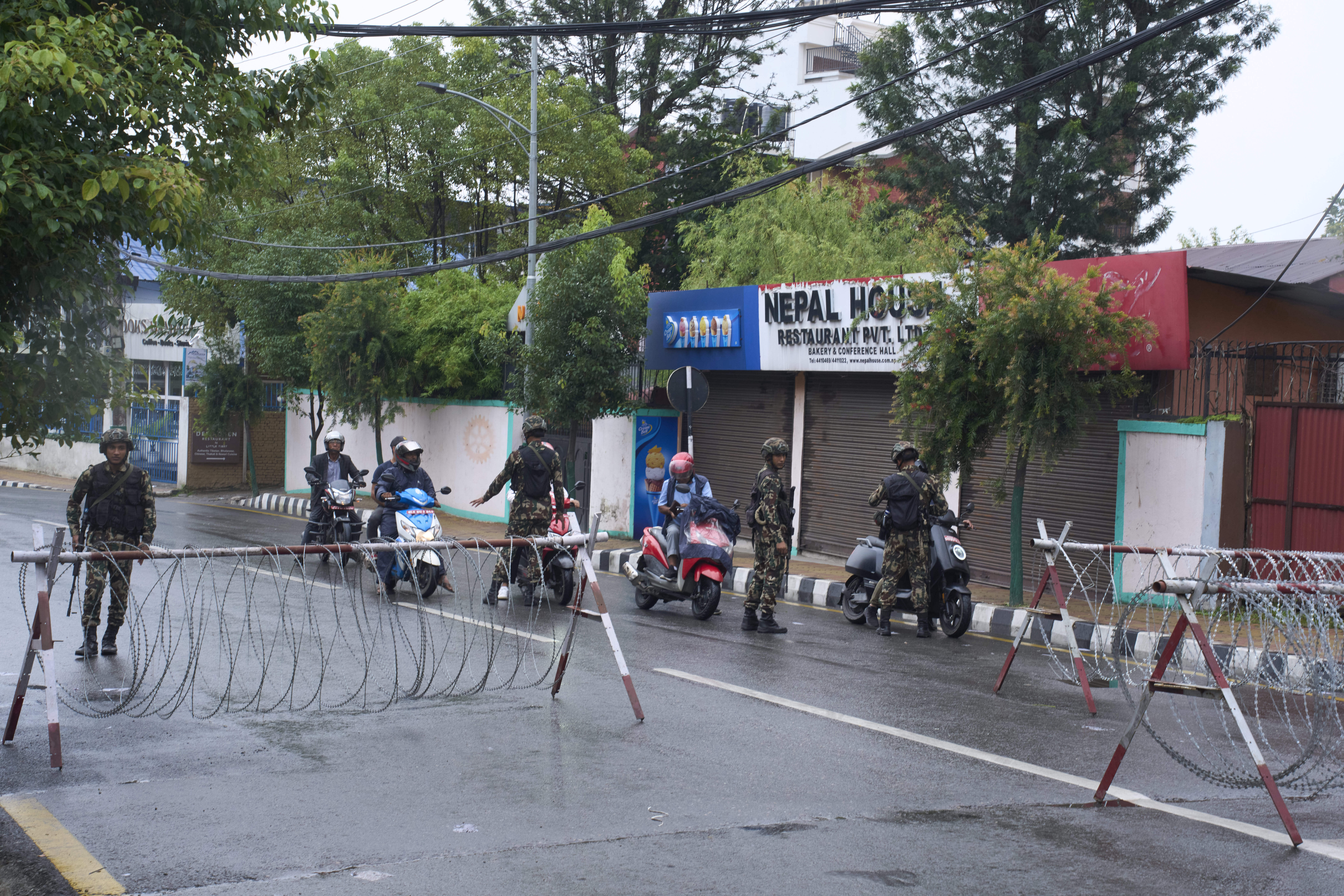 Nepalese army personnel check and question civilians at a checkpoint in Kathmandu, Nepal, Wednesday, Sept. 10, 2025. (Niranjan Shrestha - AP)