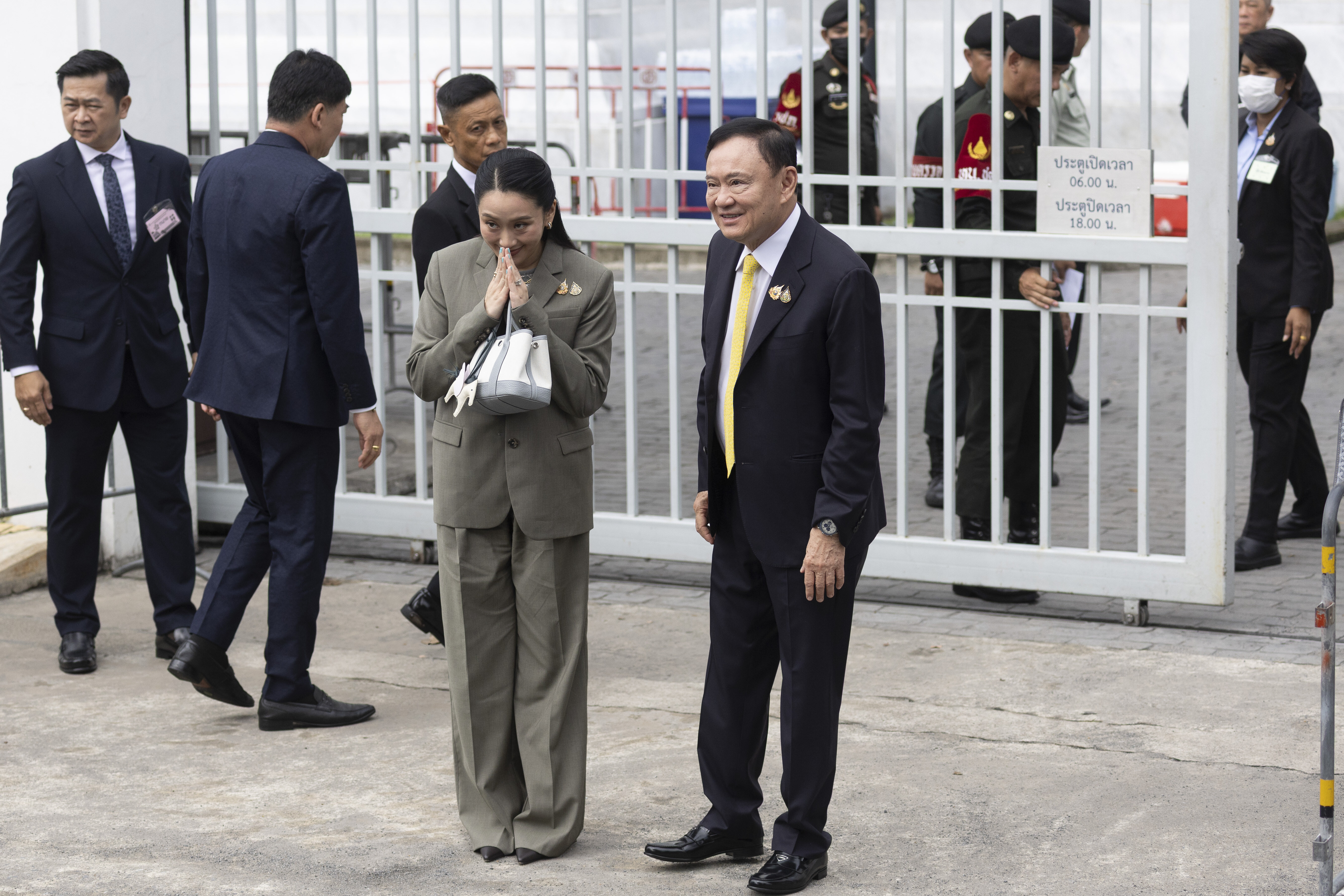 CORRECTS NAME OF DAUGHTER - Thailand’s former Prime Minister Thaksin Shinawatra, center right, and his daughter and former Prime Minister Paetongtarn Shinawatra, center left, arrive at Supreme Court in Bangkok, Thailand, Tuesday, Sept. 9, 2025. (Wason Wanichakorn - AP)