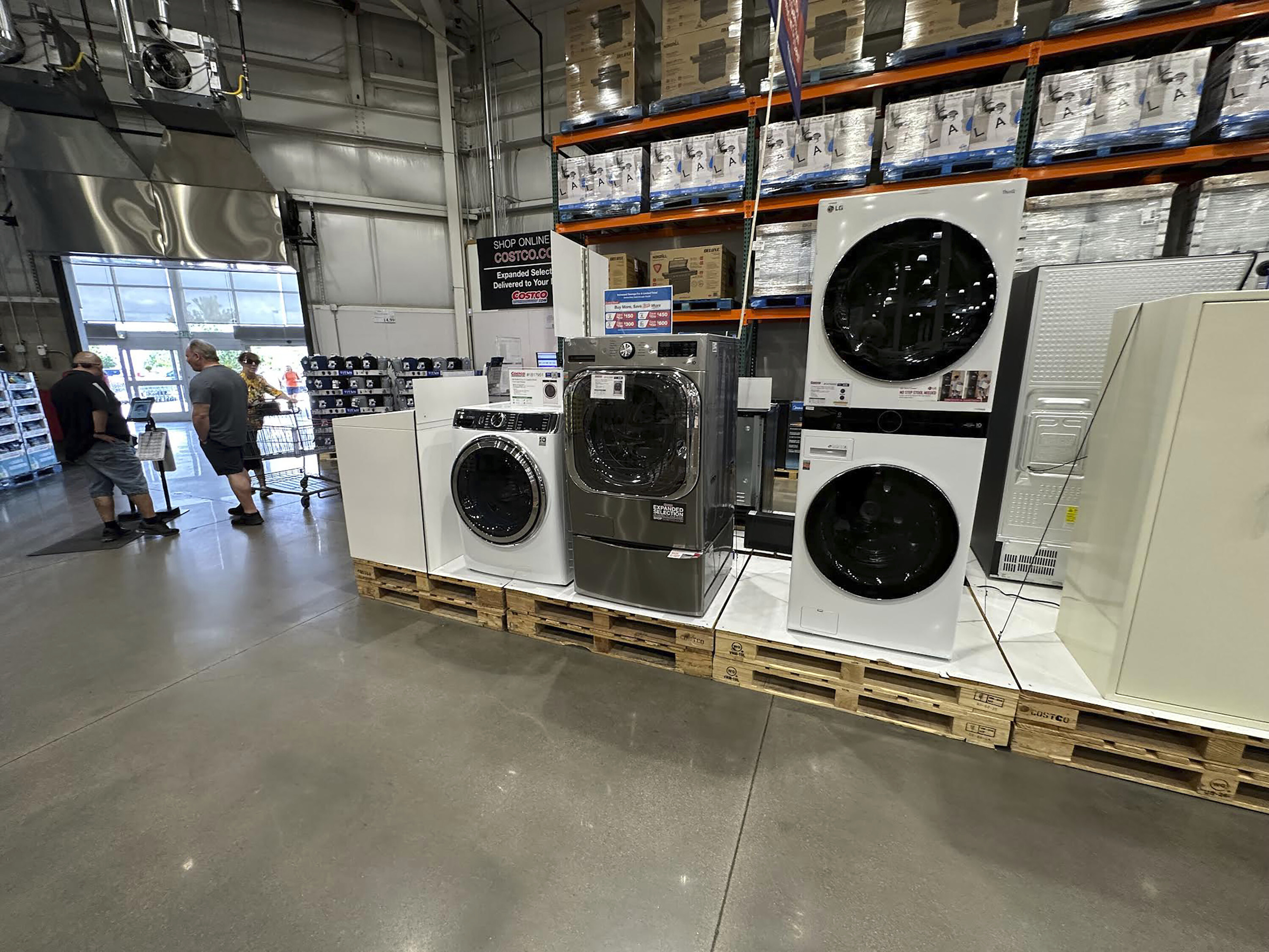 FILE - Washers stand on display near the entrance to a Costco warehouse Tuesday, July 8, 2025, in Sheridan, Colo. (David Zalubowski - AP)