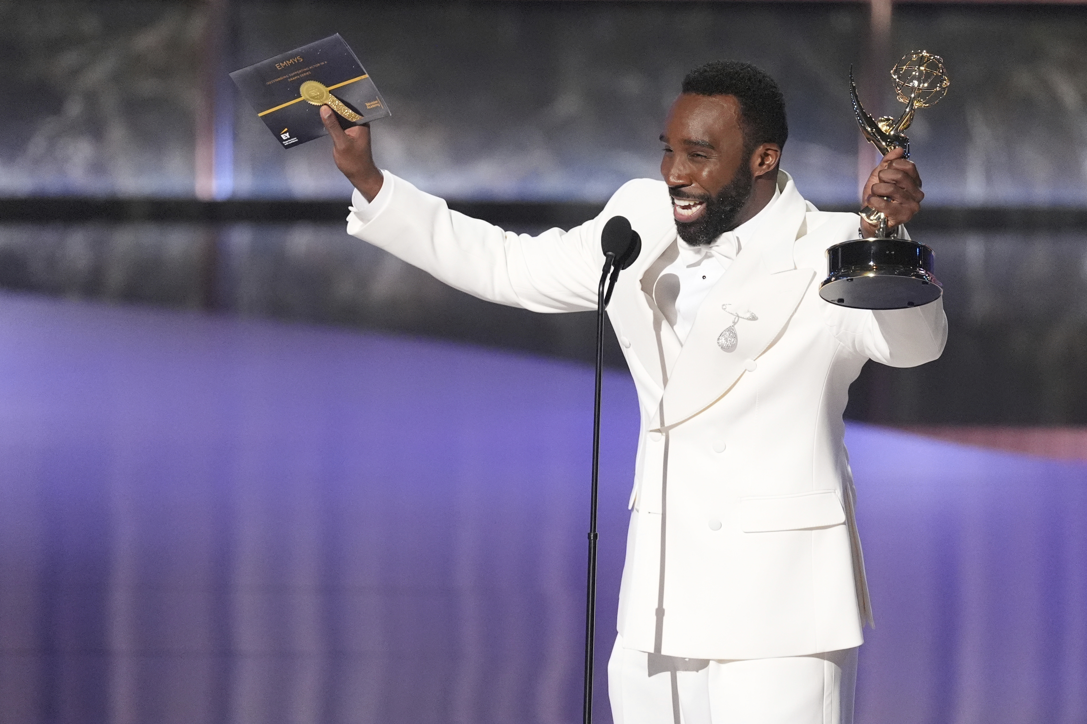 Tramell Tillman accepts the award for outstanding supporting actor in a drama series for 
