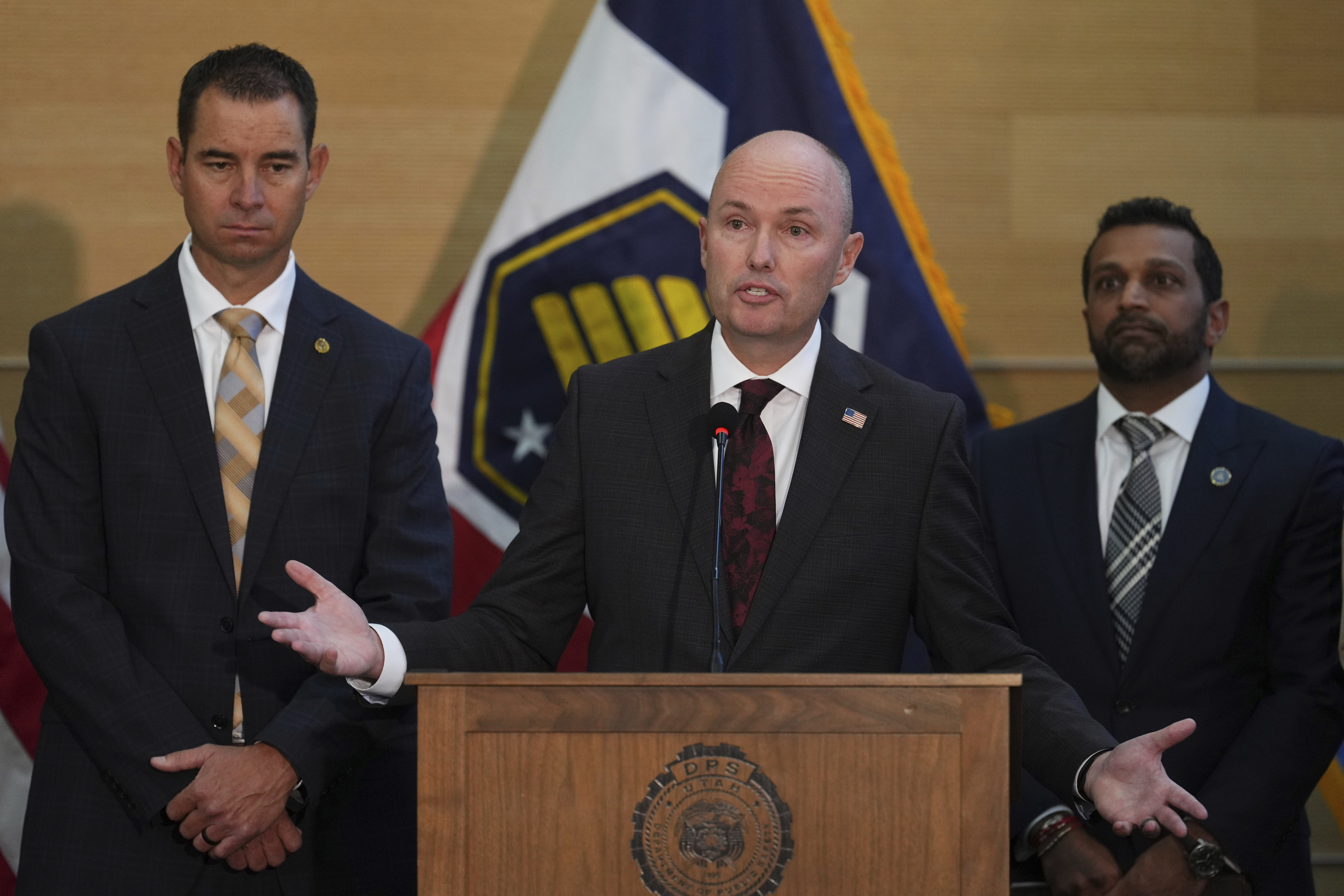 Utah Gov. Spencer Cox speaks at a news conference, as Utah department of public safety commissioner Beau Mason, left, and FBI Director Kash Patel listens, Friday, Sept. 12, 2025, in Orem, Utah. (Lindsey Wasson - AP)