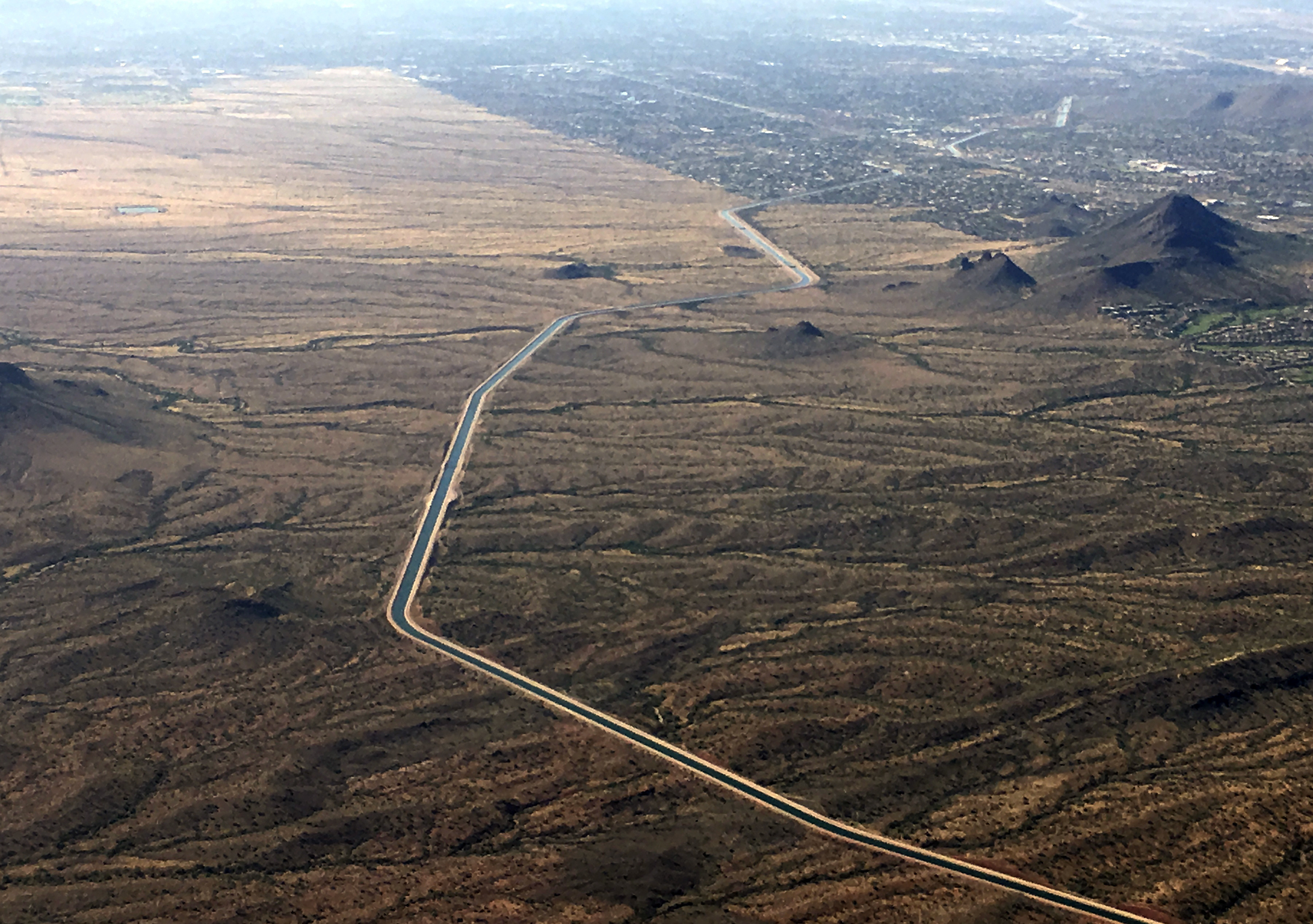 FILE - The Central Arizona Project canal runs through rural desert near Phoenix, Oct. 8, 2019. (Ross D. Franklin - AP)