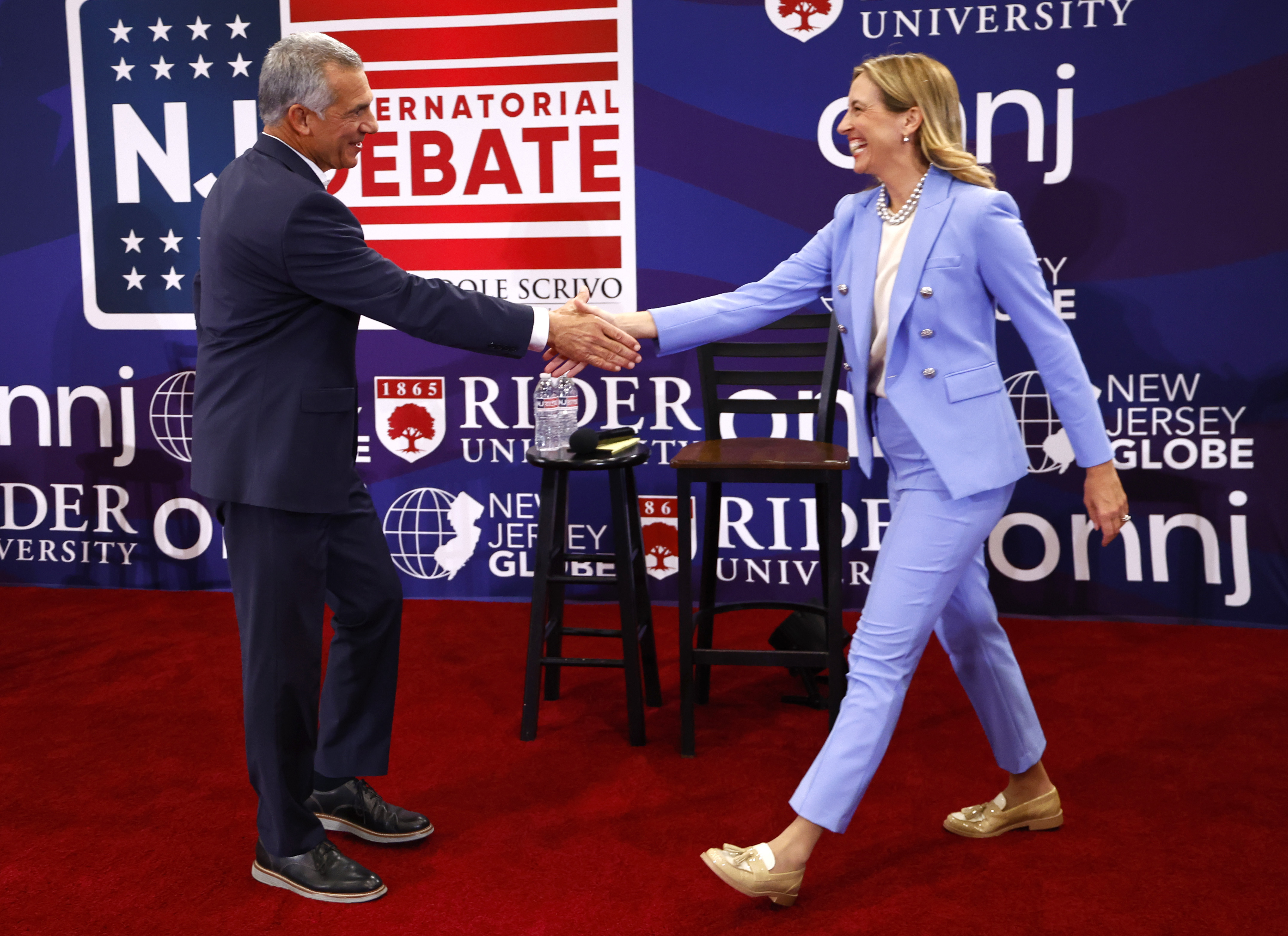 Republican candidate Jack Ciattarelli, left, shake hands with Democratic candidate for governor Mikie Sherrill, right, and before debate Sunday, Sept. 21, 2025, in Lawrenceville, N.J. (Noah K. Murray - FR171374 AP)