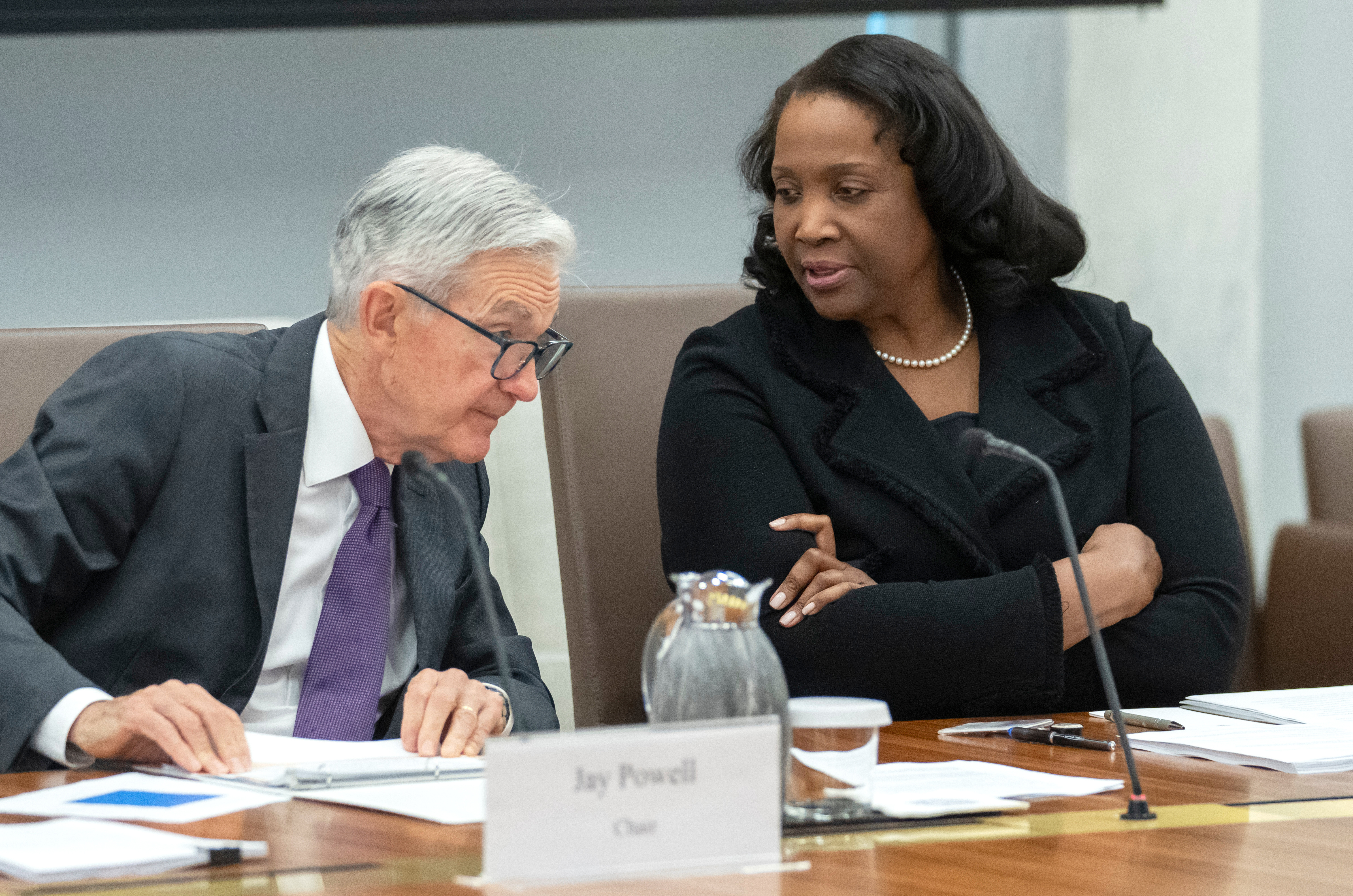 FILE - Federal Reserve Board of Governors member Lisa Cook, right, talks with Federal Reserve Chairman Jerome Powell before an open meeting of the Board of Governors at the Federal Reserve, June 25, 2025, in Washington. (Mark Schiefelbein - AP)