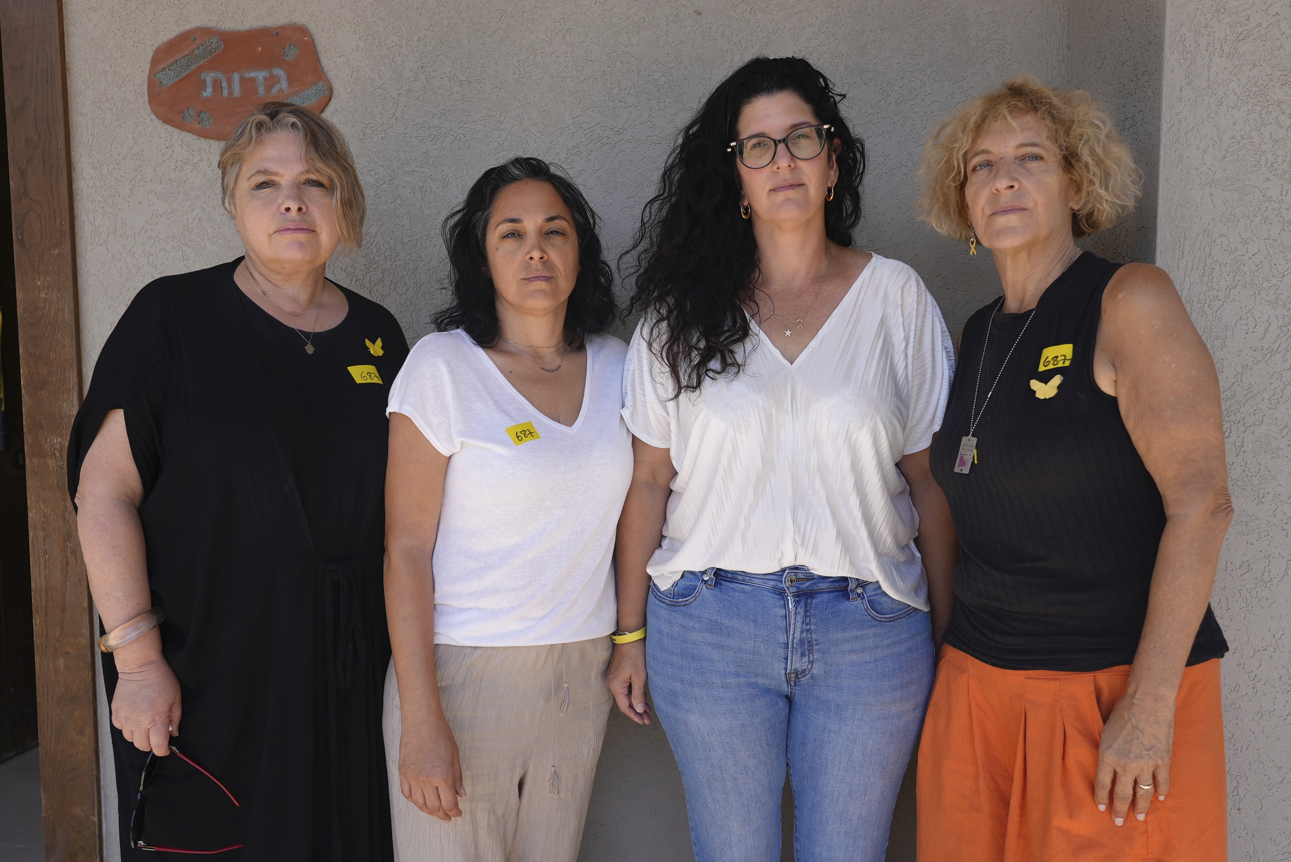 From left: Noorit Felsenthal-Berger, Bat El, Yifat Gadot, Paula Keusch, mothers of soldiers who have fought in Gaza, pose for a photo outside a house in Tal Shahar, central Israel, Saturday Aug. 23, 2025. (Sam Mednick - AP)