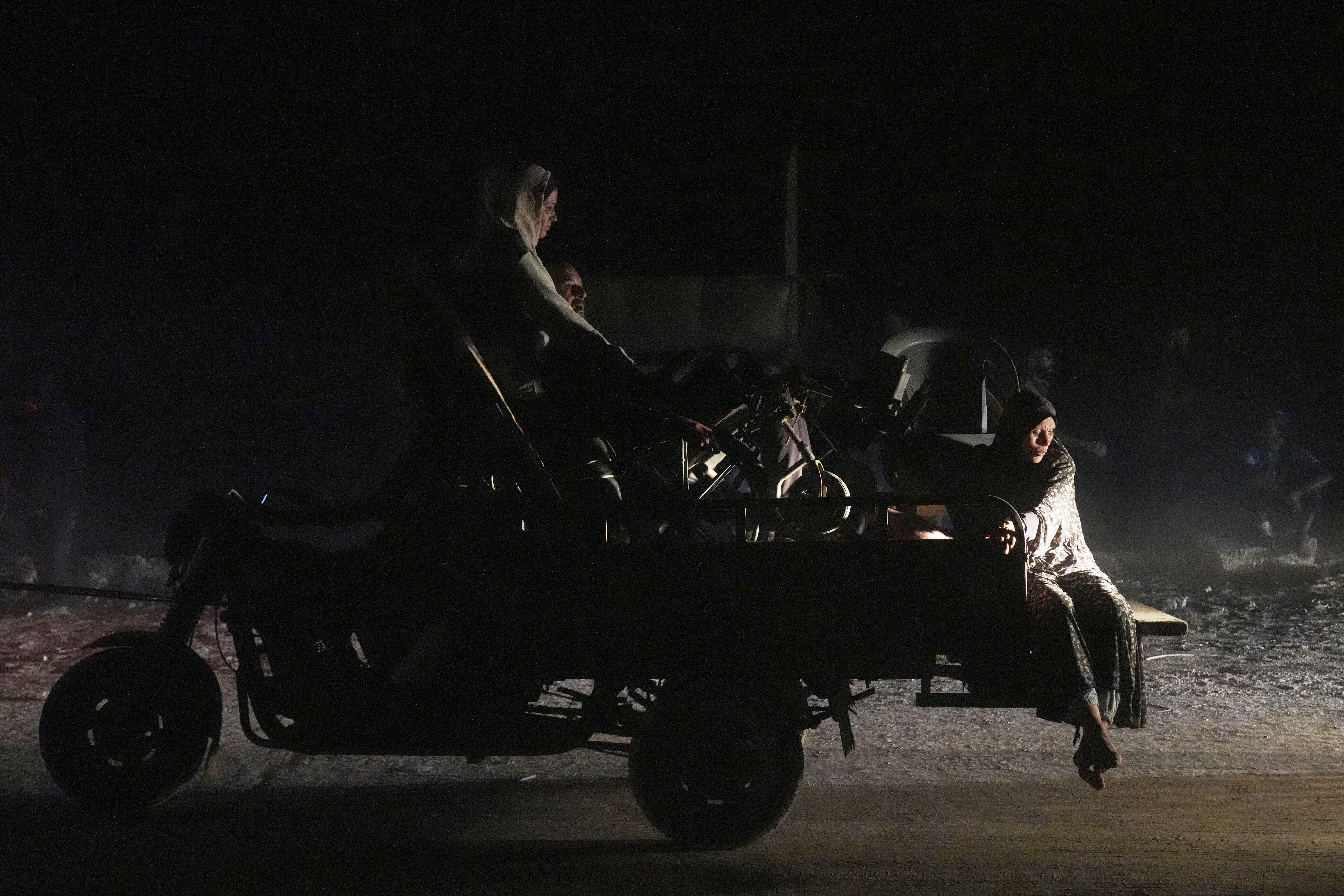 Displaced Palestinians flee Gaza City carrying their belongings along the coastal road toward southern Gaza, Thursday, Sept. 18, 2025. (Abdel Kareem Hana - AP)