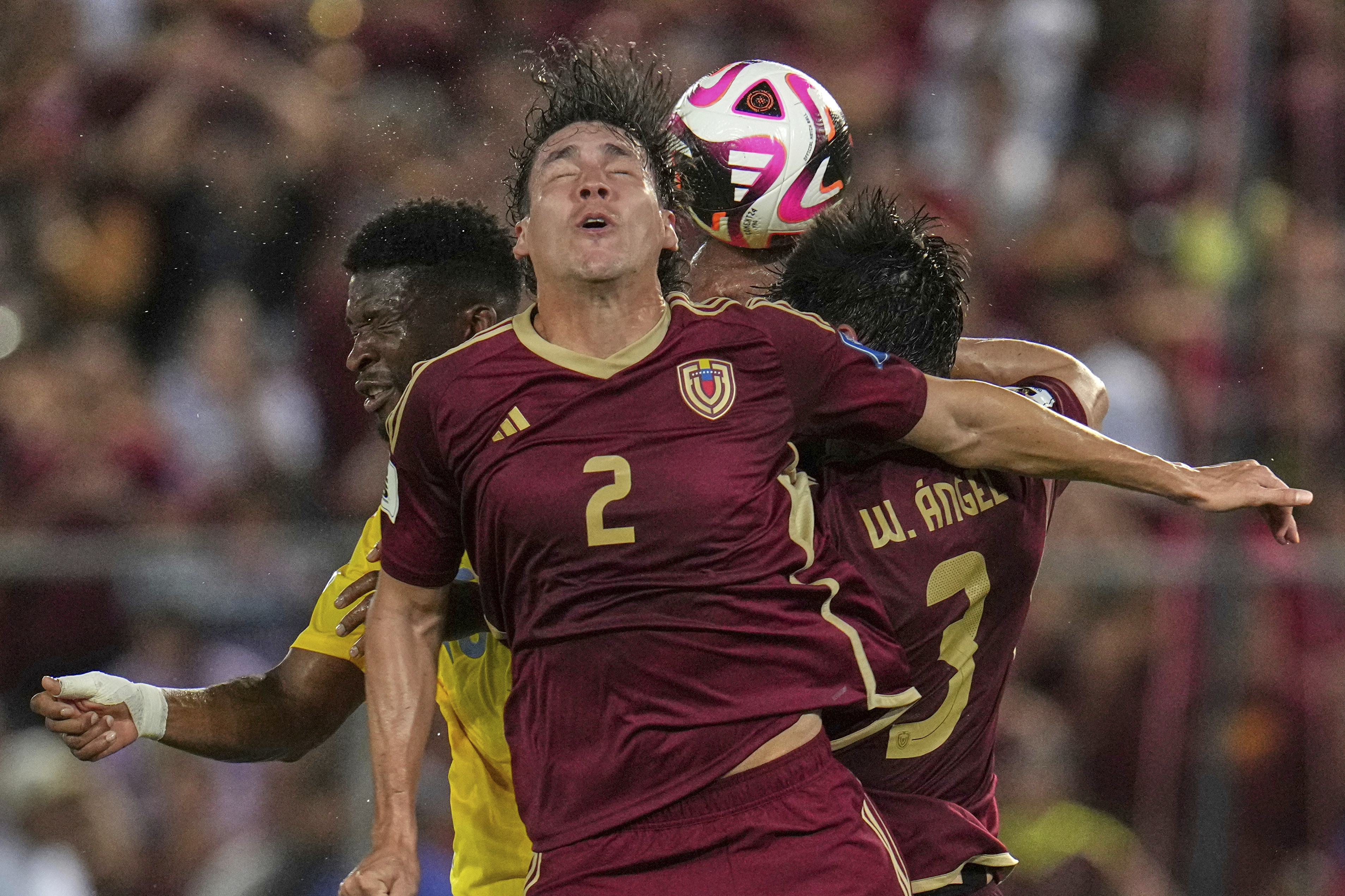 Venezuela's Nahuel Ferraresi heads the ball during a World Cup 2026 qualifying soccer match against Colombia in Maturin, Venezuela, Tuesday, Sept. 9, 2025. (Ariana Cubillos - AP)
