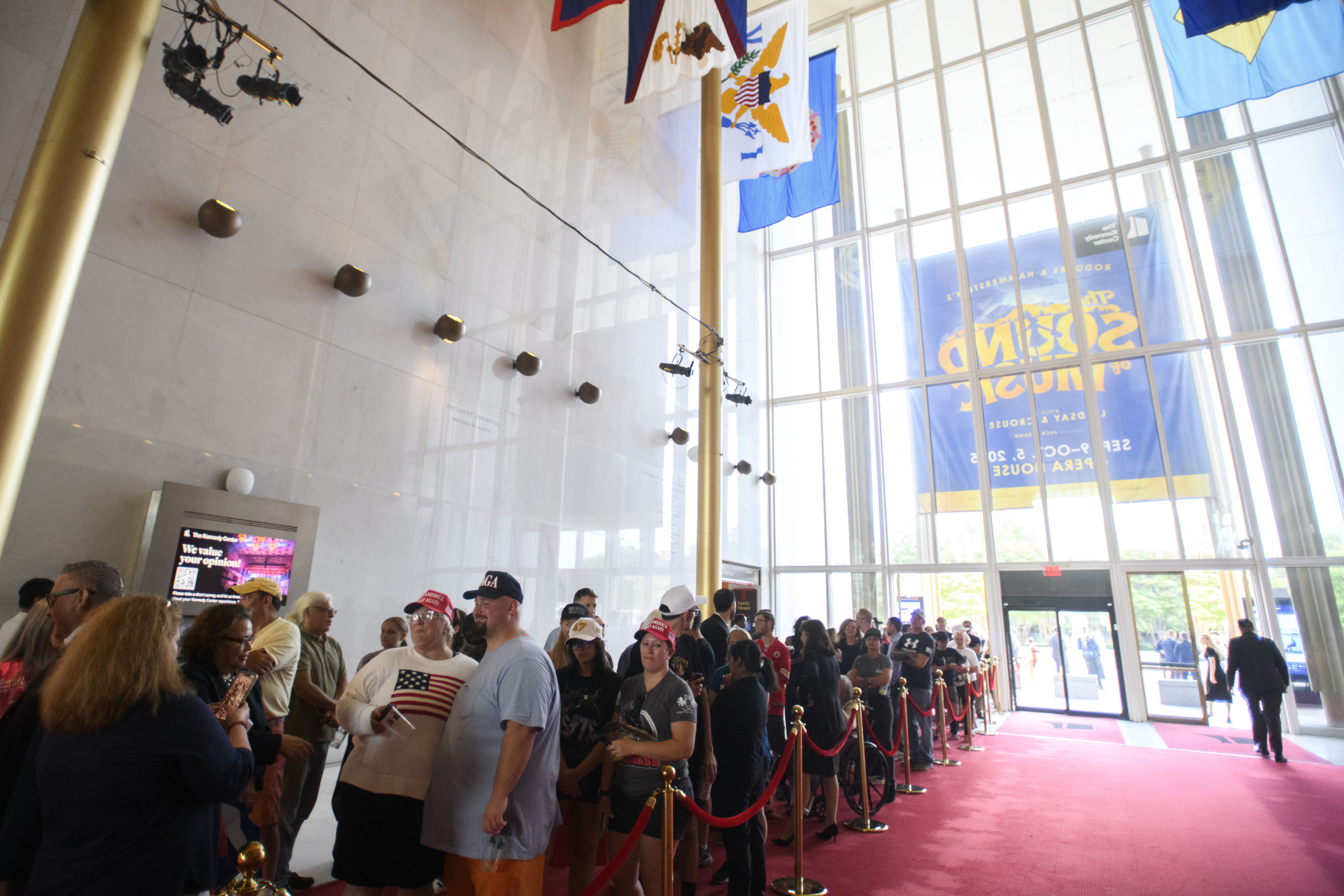 People wait in line for a memorial and prayer vigil for Charlie Kirk at the John F. Kennedy Memorial Center for the Performing Arts, Sunday, Sept. 14, 2025, in Washington. (Rod Lamkey - FR172078)