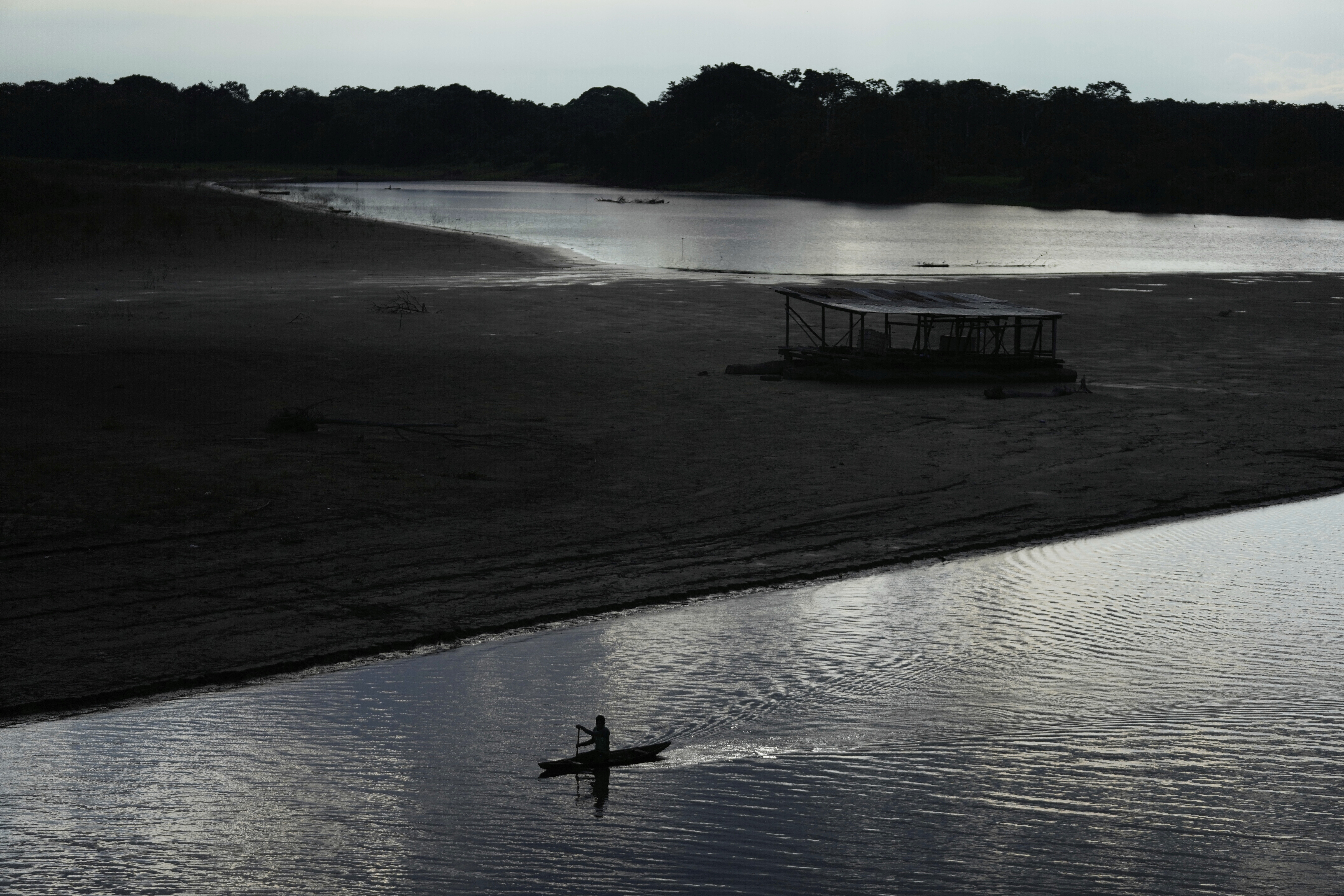 A fisherman paddles his boat on the Amazon river in Puerto Narino, Colombia, Saturday, Sept. 6, 2025. (Fernando Vergara - AP)