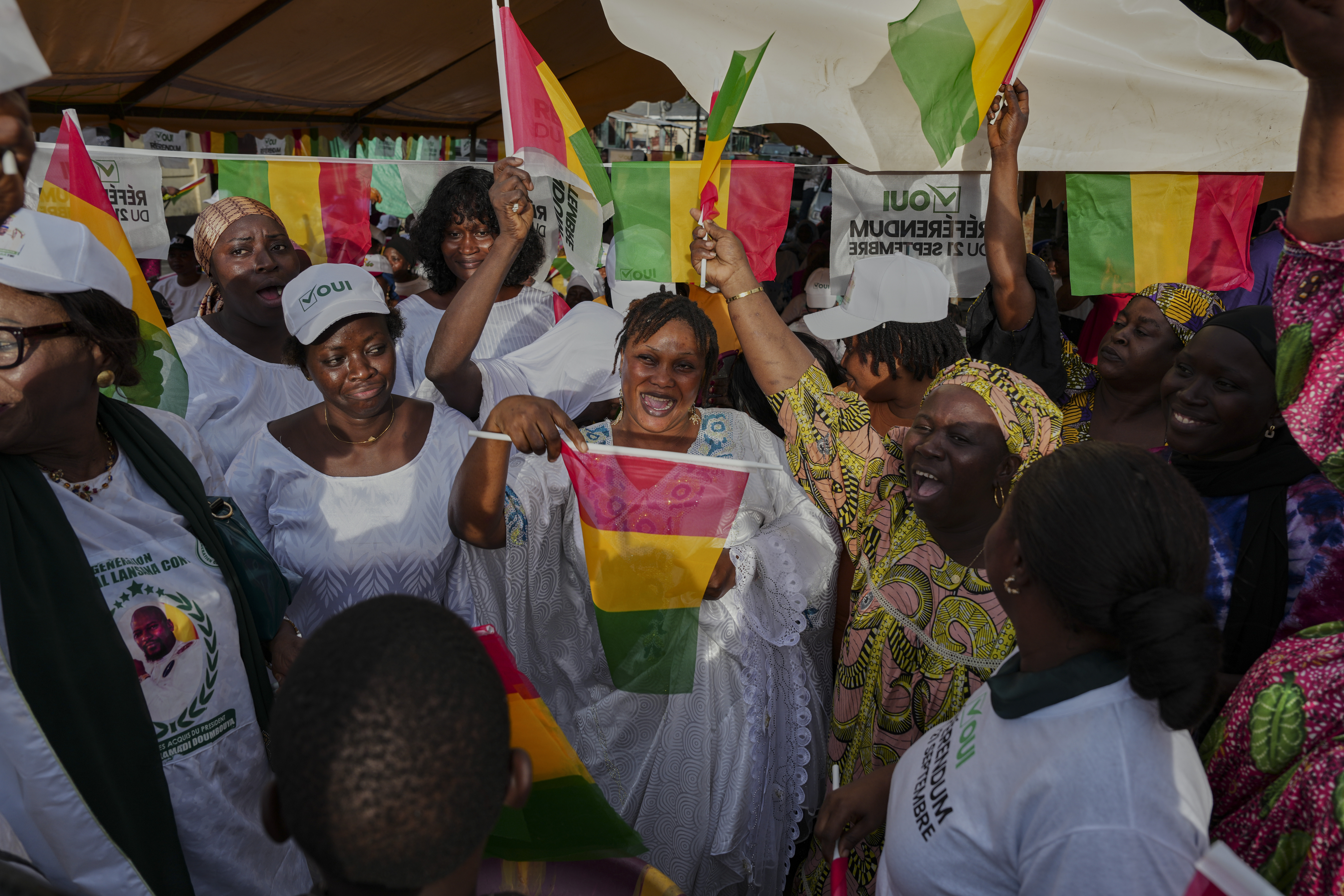 Supporters cheer and wave Guinean flags during a community rally ahead of the constitutional referendum in Conakry, Guinea, Monday, Sept. 15, 2025. (Misper Apawu - AP)
