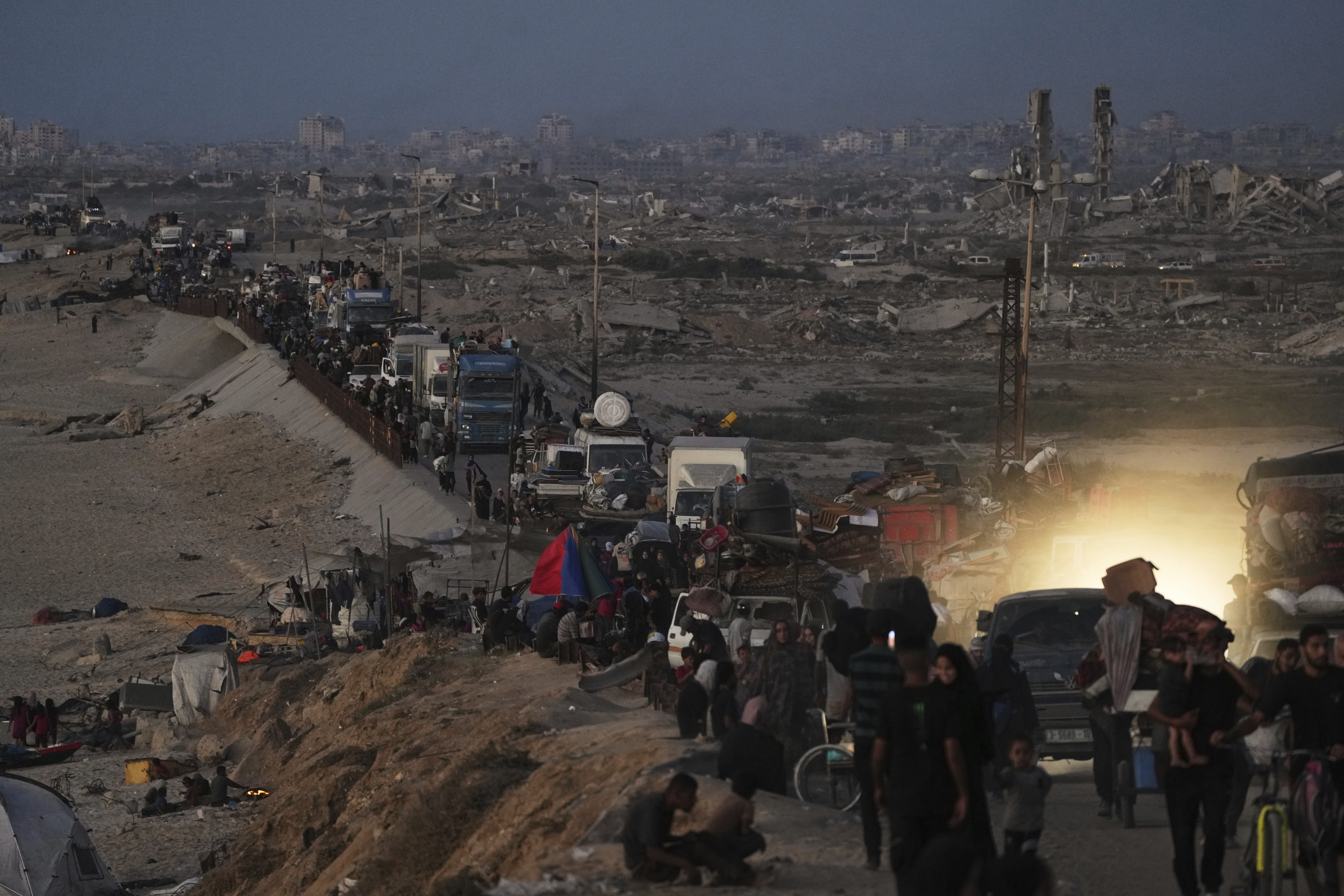 Displaced Palestinians flee northern Gaza along the coastal road toward the south, as Israel announced an expanded operation in Gaza City, Tuesday, Sept. 16, 2025. (Abdel Kareem Hana - AP)