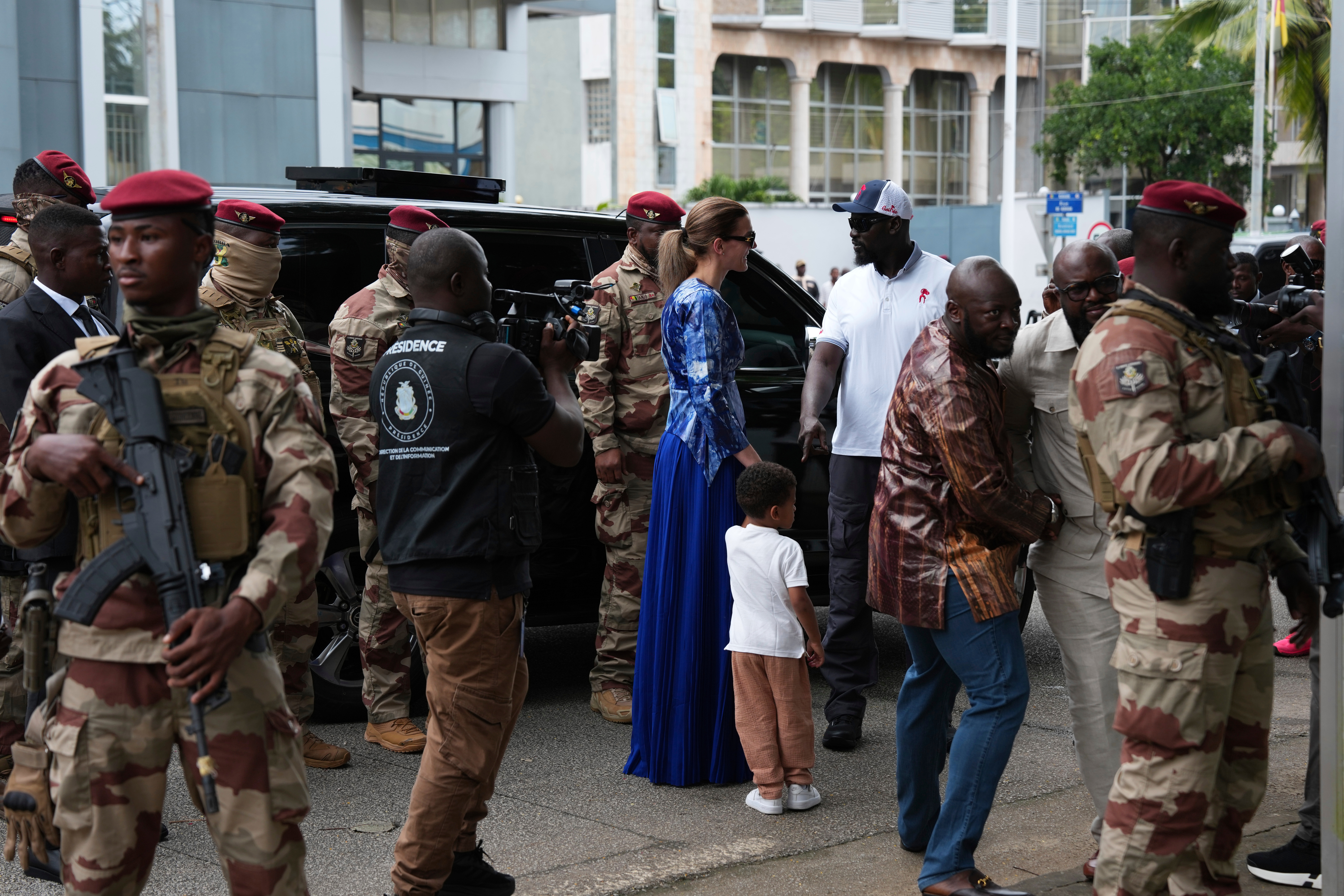 Guinea's interim President, Gen. Mamadi Doumbouya, arrives with his family to cast his vote in the constitutional referendum, in Conakry, Guinea, Sunday, Sept. 21, 2025. (Misper Apawu - AP)