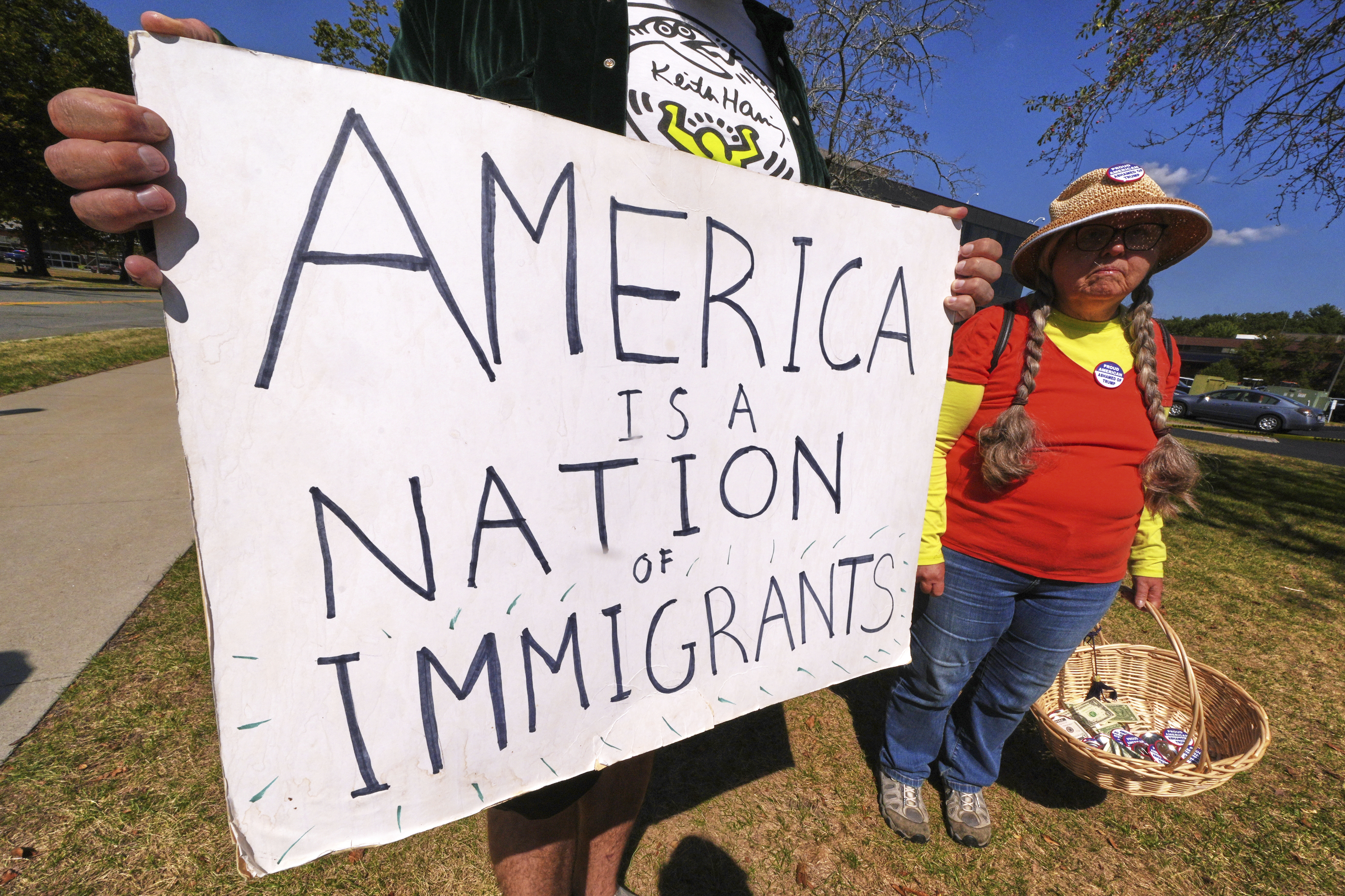 Protesters picket outside the U.S. Immigration and Customs Enforcement regional field office, Thursday, Sept. 11, 2025, in Burlington, Mass. (Charles Krupa - AP)