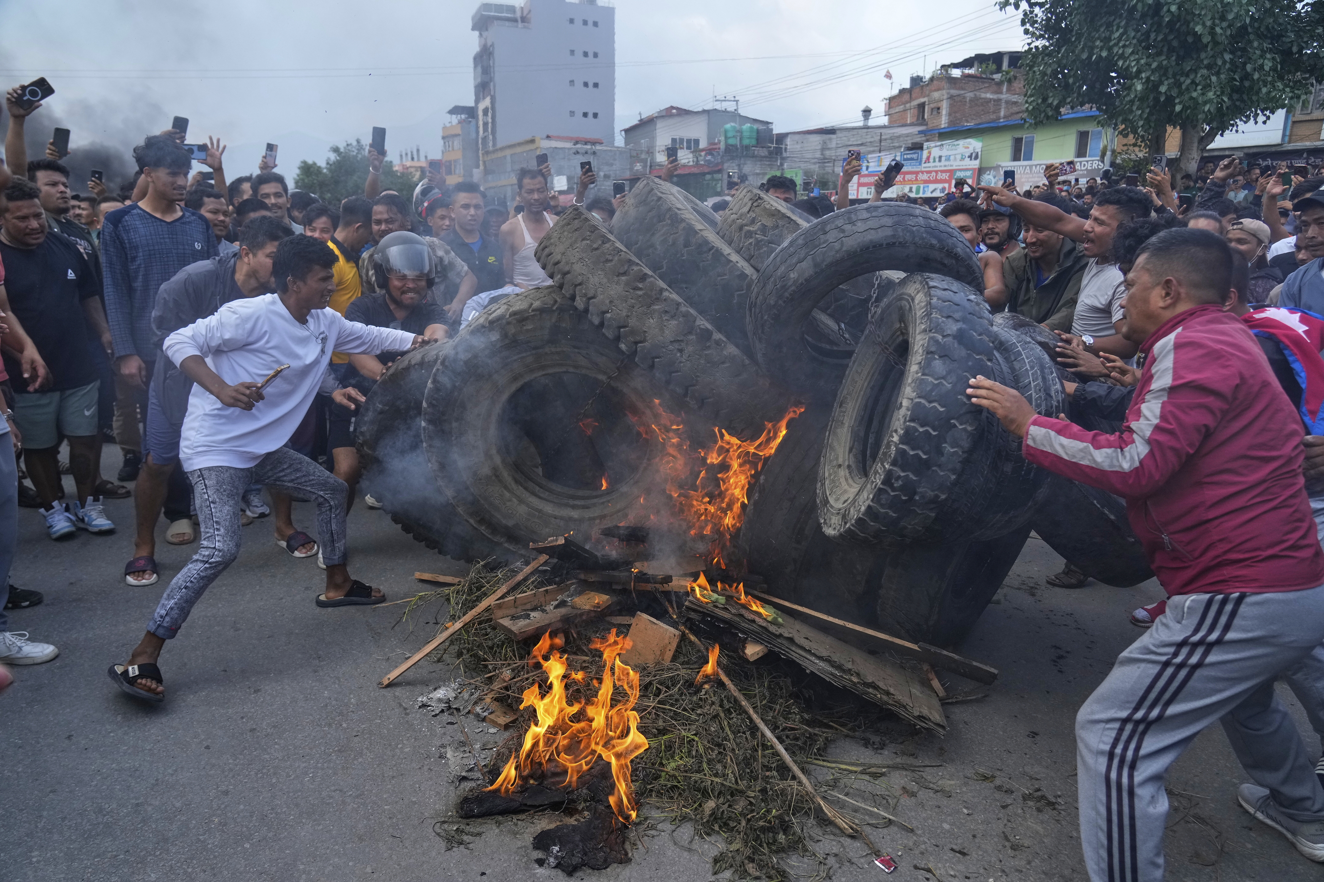 Protesters burn tires violating the curfew orders in Kathmandu, Nepal, Tuesday, Sept. 9, 2025. (Niranjan Shrestha - AP)