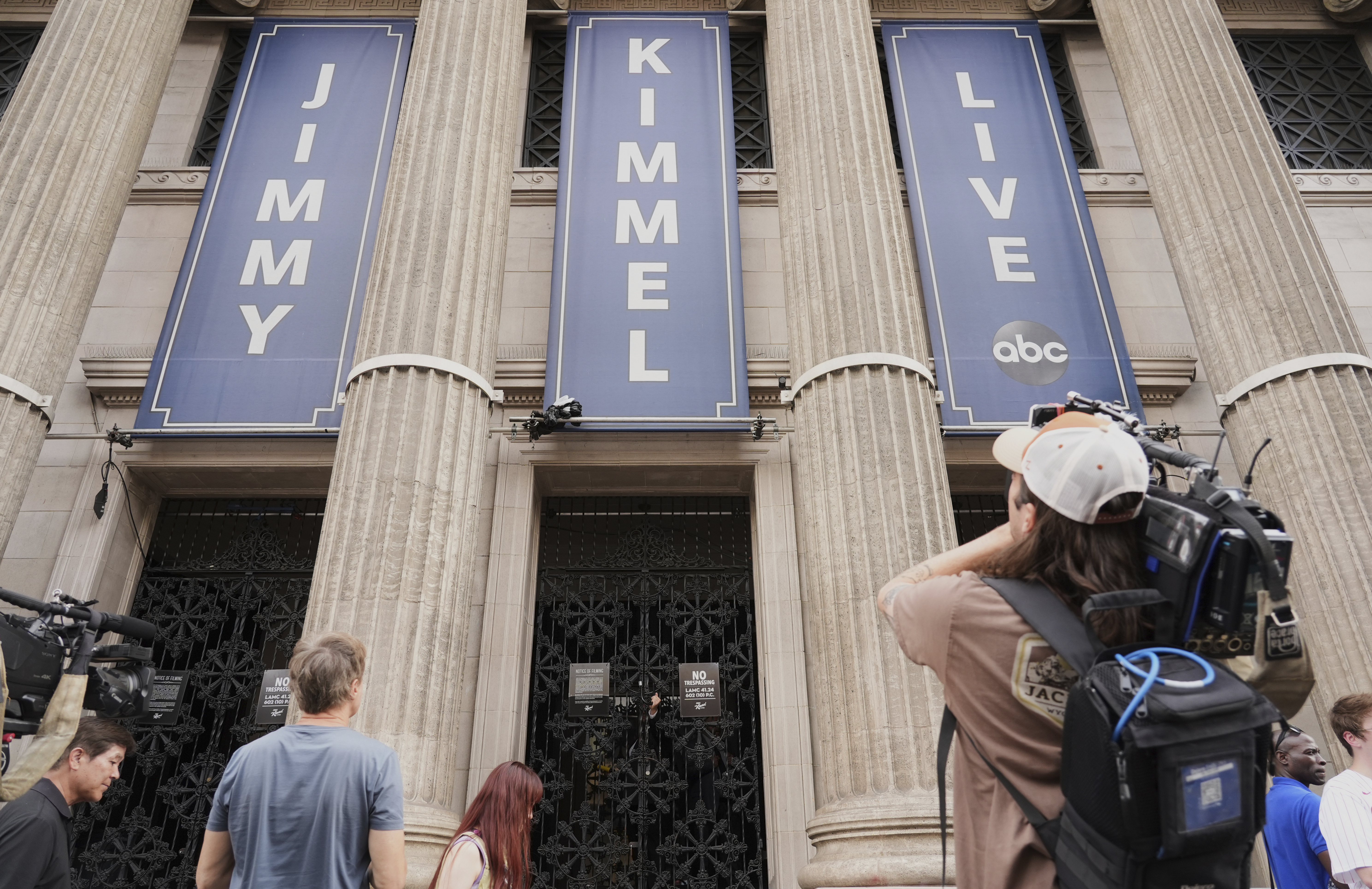 Media gather in front of the Jimmy Kimmel Live studio on Hollywood Blvd., Wednesday, Sept. 17, 2025, in Los Angeles. (Chris Pizzello - Invision)
