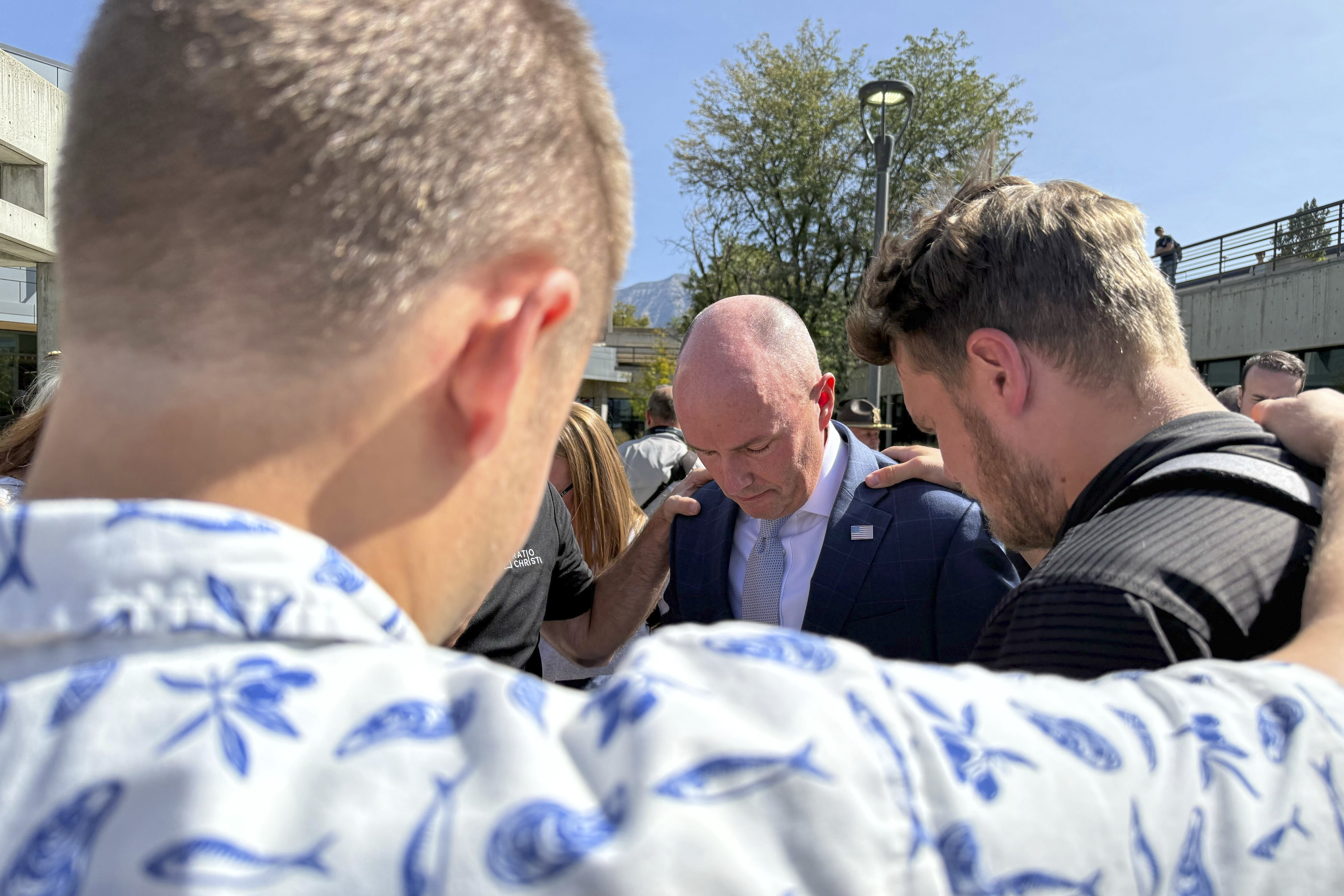 Utah Gov. Spencer Cox, center, prays with students at Utah Valley University Wednesday, Sept. 17, 2025, in Orem, Utah, during the first day back on campus after conservative activist Charlie Kirk was shot and killed on campus last week. (Jesse Bedayn - AP)