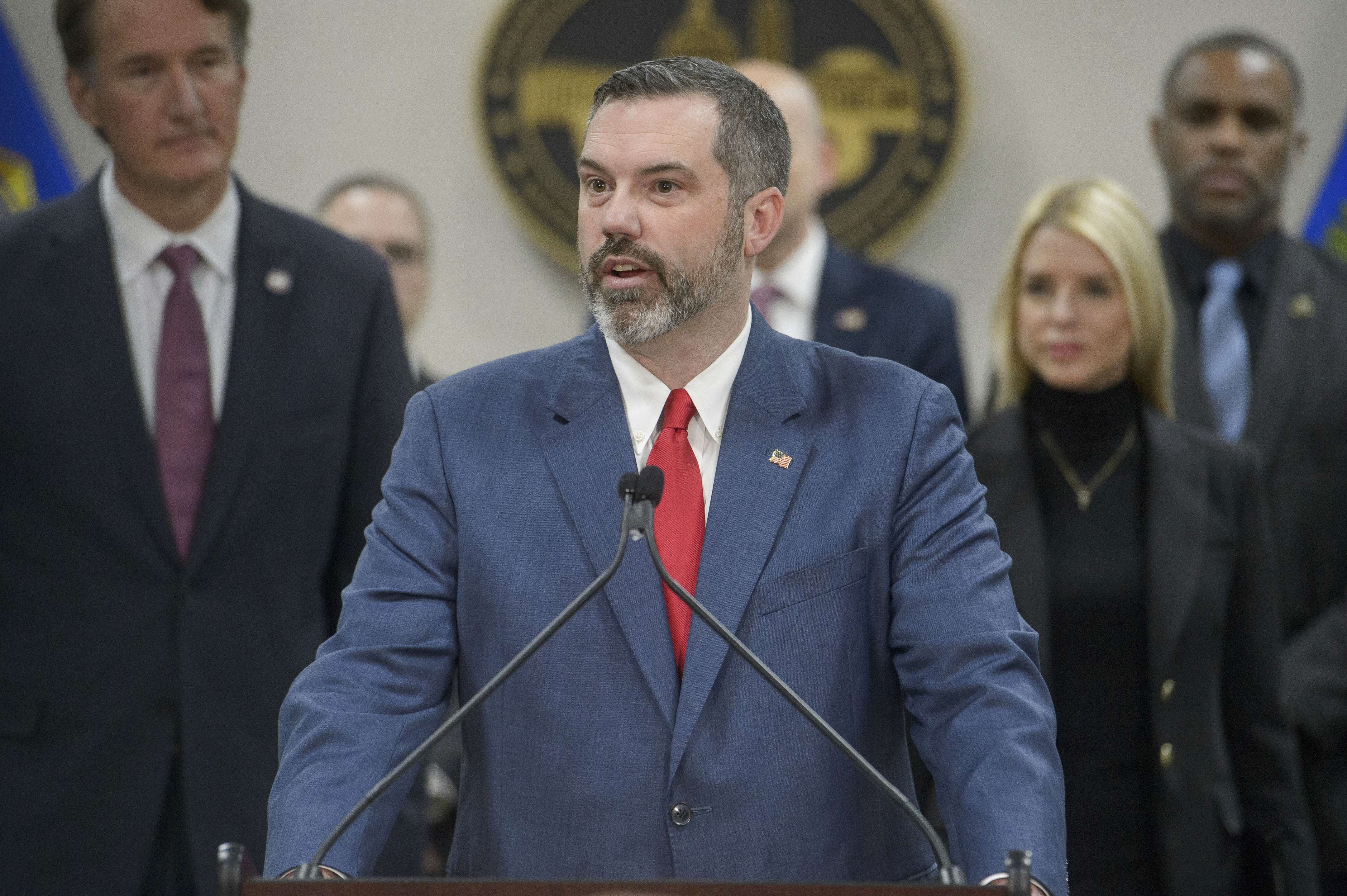 FILE - Erik Siebert, interim U.S. Attorney for the eastern district of Virginia, speaks as Attorney General Pam Bondi, right, and Virginia Gov. Glenn Youngkin, left, listen during a news conference at the Manassas FBI Field Office, March 27, 2025, in Manassas, Va. (Rod Lamkey - FR172078)