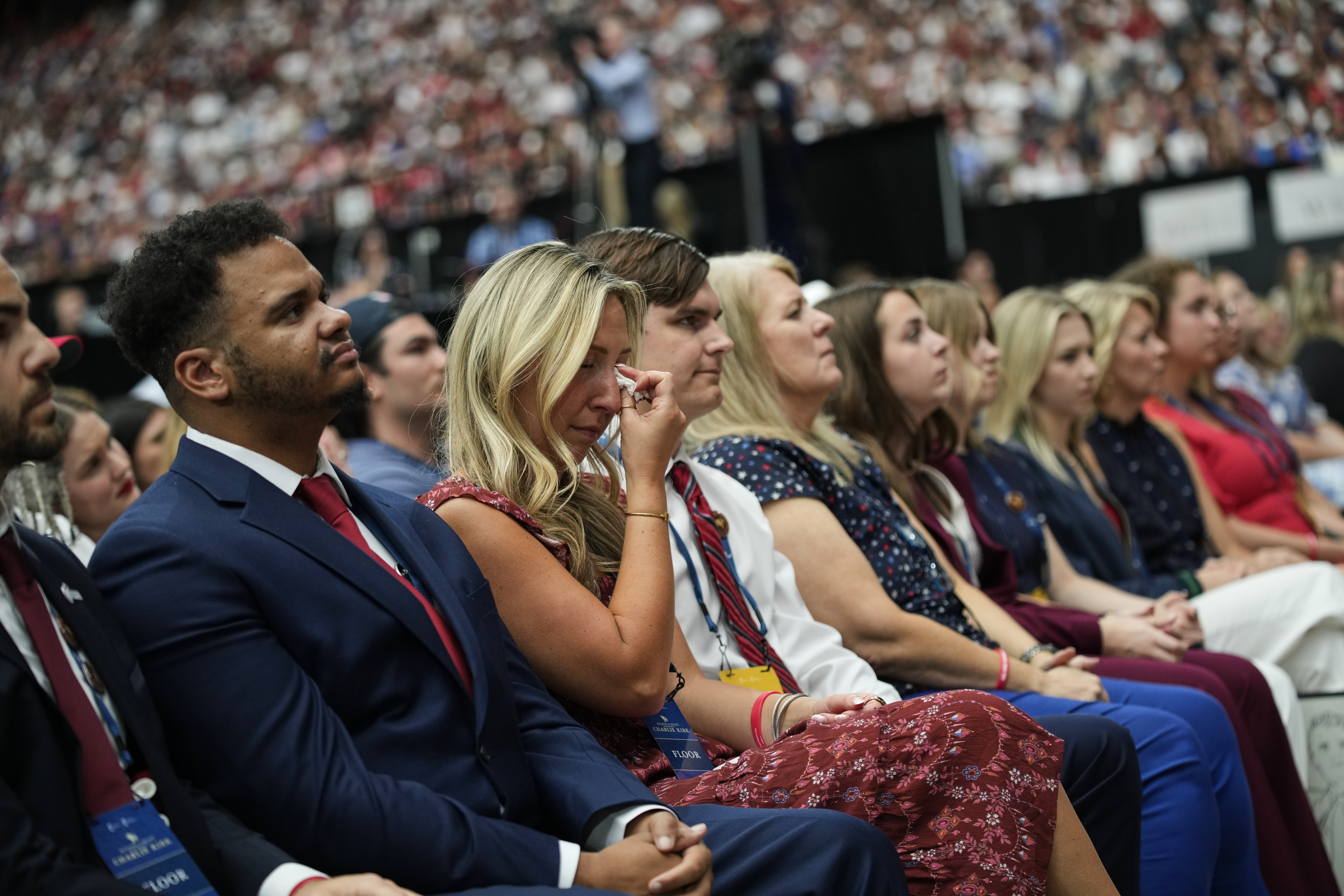People listen as Erika Kirk speaks at a memorial for her late husband conservative activist Charlie Kirk, Sunday, Sept. 21, 2025, at State Farm Stadium in Glendale, Ariz. (John Locher - AP)